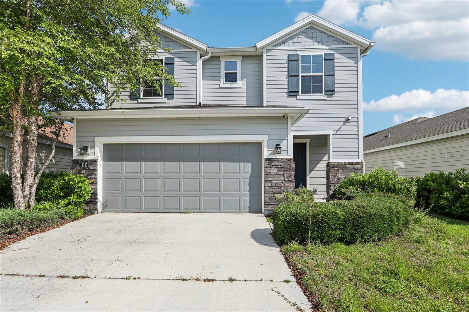 This beautifully maintained two-story home offers 3 generously sized bedrooms, 2.5 bathrooms, and a versatile loft space—ideal for a home office, playroom, or media room. The thoughtfully designed open-concept layout features a U-shaped kitchen with a convenient breakfast bar, perfect for casual dining and effortless entertaining. Step outside to a serene back porch overlooking a tranquil pond, providing a peaceful and private retreat. Additional highlights include ceiling fans throughout, a spacious two-car garage, and an efficient floorplan tailored for modern living. Energy-saving features such as a radiant barrier and double-tinted windows help reduce utility costs year-round. Ideally situated just minutes from the popular Durbin Pavilion, you'll enjoy easy access to premier shopping, dining, grocery stores, and medical facilities. Commuters will appreciate quick connectivity to I-95 and 9B, offering a direct route to downtown Jacksonville, St. Augustine, and area beaches.