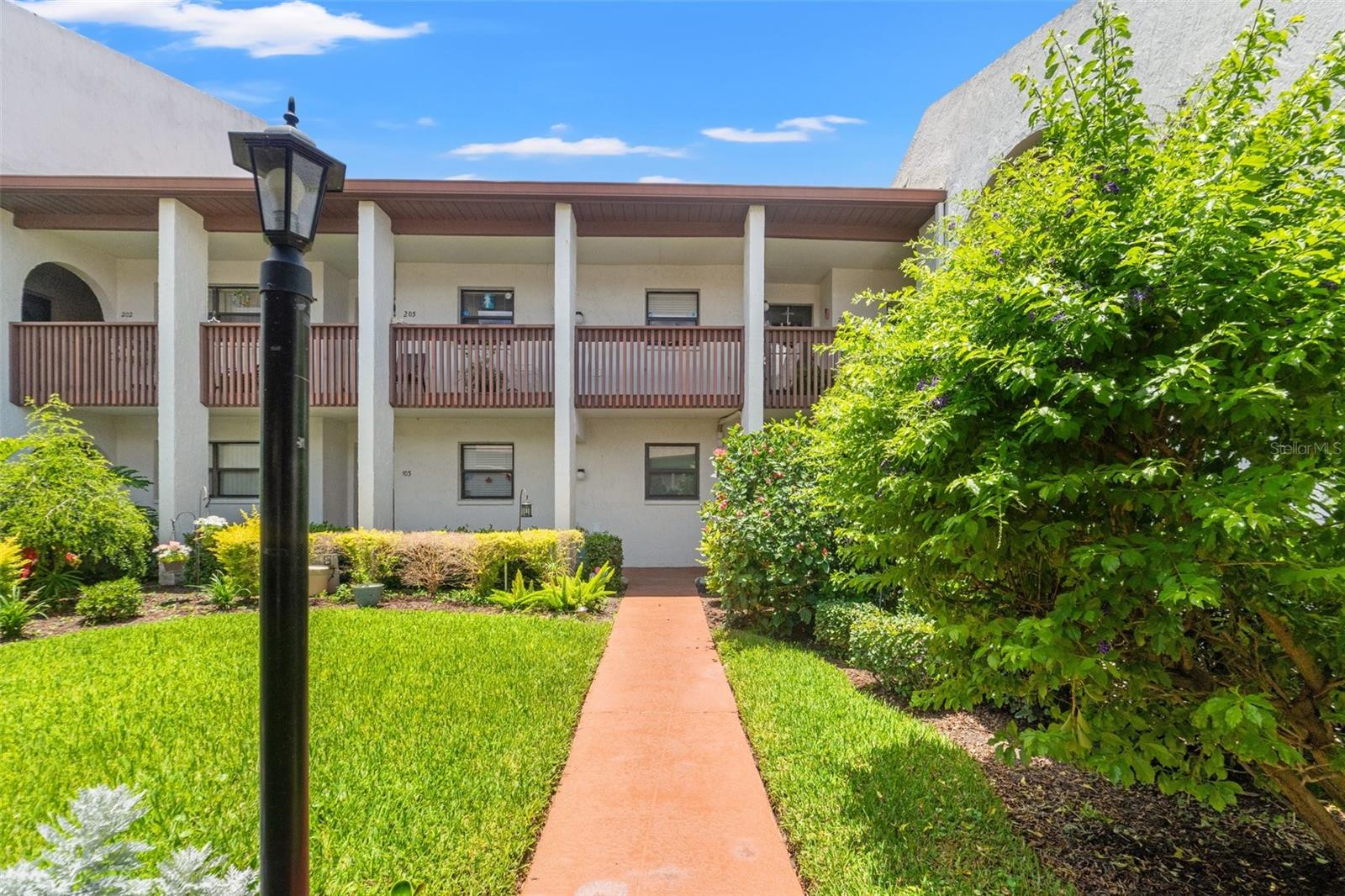 Welcome to one of the most sought-after homes in this beautifully maintained, gated 55+ community—where corner units like this are rarely available! This 2-bedroom, 2-bathroom condo is move-in ready and ideally positioned to enjoy peaceful pond views from not one, but two private balconies.
Enjoy low-maintenance living with no carpet, no CDD, and a covered carport that includes a small storage closet. The front entrance offers beautiful curb appeal with a charming seating area and well-maintained landscaping—an inviting touch not to be missed.
Step inside to a bright and welcoming layout featuring bamboo flooring throughout. The kitchen flows seamlessly into the dining and living areas, creating the perfect space for entertaining or relaxing at home.
Located just steps from the clubhouse, pool, and spa, this pet-friendly community offers a truly convenient and comfortable lifestyle.
Only minutes from beaches, shopping, restaurants, and medical centers—this is Florida living at its finest. Schedule your private showing today—this gem won’t last long!