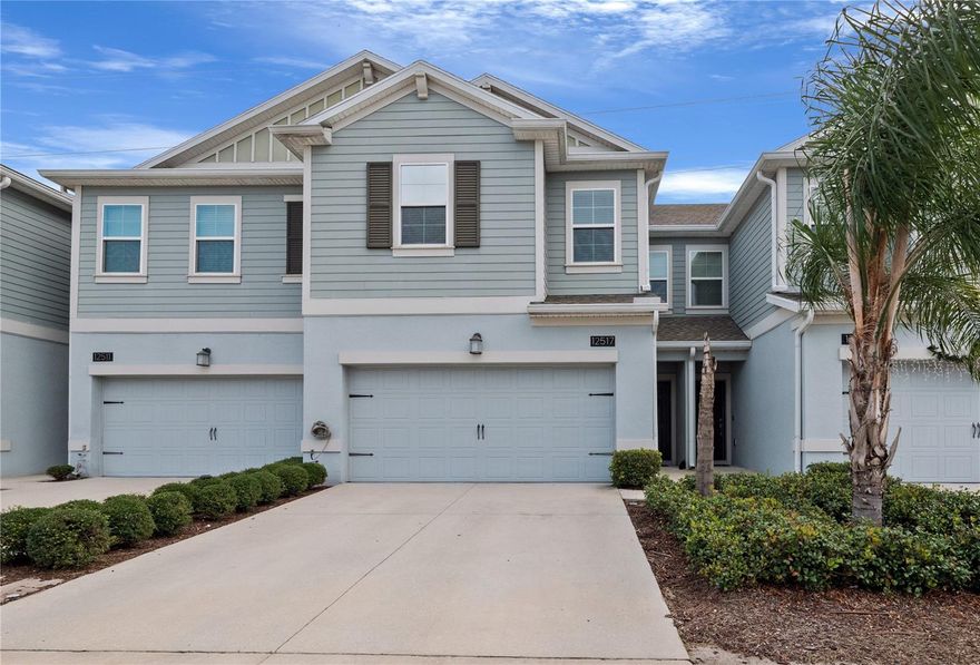 Discover luxury living in this expansive two-story townhome featuring 4 bedrooms, 2.5 bathrooms, and a 2-car garage with ample storage. Designed with a bright open floor plan, the home welcomes you into a HUGE great room that seamlessly connects to a beautifully appointed kitchen—perfect for entertaining and everyday comfort. Sliding glass doors lead to a private covered lanai, inviting relaxing indoor-outdoor living. A convenient powder room completes the thoughtfully planned first floor. Upstairs, you’ll find a spacious owner’s suite with an oversized walk-in closet and an elegant owner’s bath showcasing a large walk-in shower and modern finishes. The additional bedrooms brinda generous proportions and flexibility for family, guests, or a home office. These NEW, highly energy-efficient homes blend sophistication and value with premium 42” wood cabinetry, quartz countertops in kitchens and baths, stylish slate appliances, an advanced security system, and window blinds throughout—where comfort meets contemporary design. Located in the desirable Sawgrass Creek Townhomes Community, residents enjoy picturesque pond views, a resort-style pool and spa, clubhouse, basketball and tennis courts, soccer fields, a dog park, and beautifully maintained grounds supported by the HOA. This townhome offers the ideal setting to create lasting memories with friends and loved ones while enjoying the convenience and amenities of a vibrant modern neighborhood. Experience a home that delivers space, elegance, and the lifestyle you’ve been waiting for.