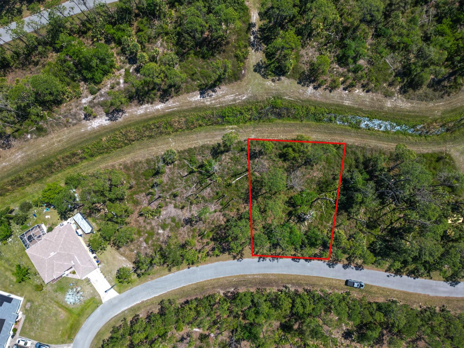 This vacant lot is tucked away on a secluded greenbelt in North Port, yet it’s just minutes from I-75, making trips to Sarasota, Venice, Port Charlotte, or even Naples quick and convenient. You’ll also be just a short drive from Wellen Park, a new community full of shops, dining, parks, walking trails, live entertainment, and the Atlanta Braves Spring Training stadium.The City of North Port continues to pop with new homes, schools, and businesses, which makes this the perfect time to secure your piece of land here in Sarasota County. With no HOA restrictions, you’ll enjoy the flexibility of designing your dream home, plus you’re close to Gulf beaches, golf courses, and beautiful nature preserves! Whether you’re dreaming of building your forever home or looking for a smart investment, this location checks all the boxes. And if you’d like assistance on the building process, our trusted custom home builder is available to walk you through every step and answer your questions! LOT TO THE RIGHT IS ALSO AVAILABLE FOR SALE (MLS: #A4663381)