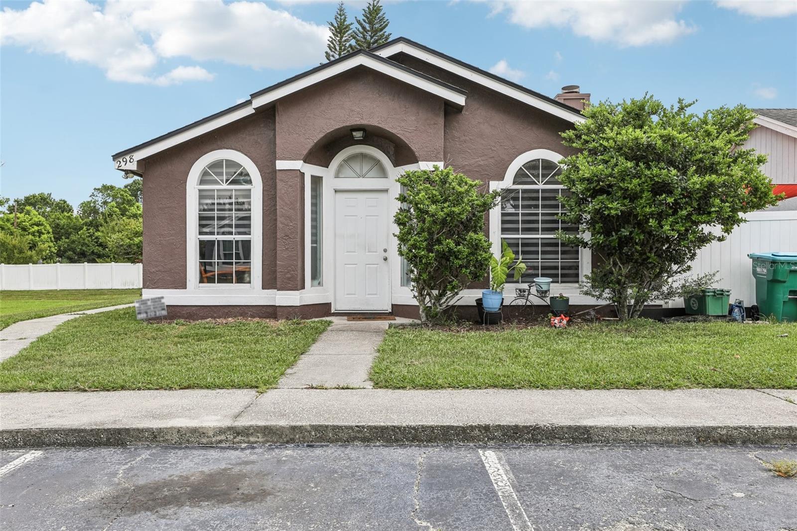 Welcome to 298 San Gabriel Street — a beautifully maintained 3-bedroom, 2-bath home perfectly situated on a desirable corner lot in the heart of Winter Springs. This property offers an exceptional location, close to some of the area’s most sought-after amenities. Enjoy the peaceful view of a large open green space right outside your window. Close proximity to Torcaso Park, a neighborhood park featuring basketball courts, a splash pad, playground, soccer and football fields, and a covered pavilion. You’ll also appreciate the convenience of being just a short distance to Schools, Winter Springs Police Department, gyms, and a variety of restaurants. Inside, the home features a bright and open layout with a spacious kitchen that flows seamlessly into the living area — perfect for entertaining. The interior has been freshly painted in clean, modern tones and showcases stylish tile flooring throughout. The updated kitchen includes modern finishes, and the sleek zebra blinds add a touch of contemporary elegance. Step outside to your own private side patio, ideal for relaxing or outdoor dining. This home is a wonderful blend of comfort, location, and lifestyle — a perfect opportunity for families, first-time buyers, or anyone looking to enjoy all that Winter Springs has to offer.