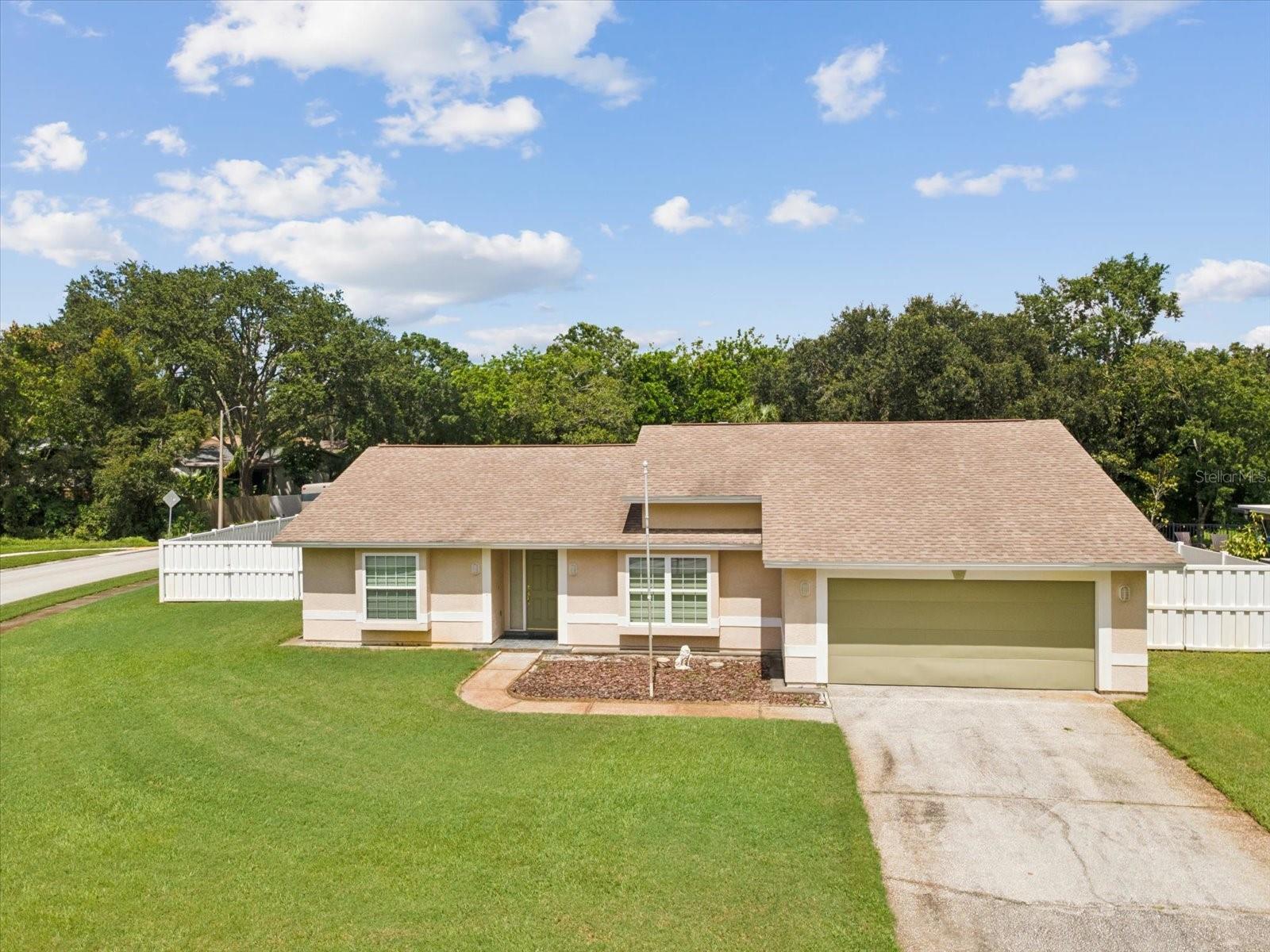Welcome home to 827 Creekside Lane, where charm meets functionality on a spacious .45 acre lot! This beautifully maintained split floor plan home features tall ceilings, a spacious kitchen with a cozy window seat, and a versatile flex room/den that can easily be converted into a third bedroom or home office. The primary suite includes a large walk-in closet, creating a peaceful retreat.
Car lovers and hobbyists will swoon over the 3-car mechanics’ garage, complete with front and back garage doors for added access and flexibility. Enjoy peace of mind with a brand new AC (2024) and appreciate the convenience of a no-HOA neighborhood, just minutes from award-winning beaches, top-rated schools, vibrant shopping, dining, and easy access to US-19 and Alt-19.
Located near the Pinellas Trail, Honeymoon Island, and Downtown Dunedin, this home is perfect for all! Whether you’re biking to the beach, launching your next project in the garage, or enjoying coffee on the patio — this oasis offers the lifestyle you’ve been looking for!