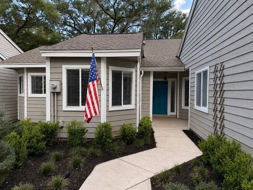 Welcome home to this charming 2-bedroom, 2-bath villa located in the heart of Jonesville area. Nestled beneath mature oak trees in The Villas of West End, this beautifully maintained home offers peaceful views of walking trails at the West End Community park while being just minutes from Tioga Town Center, Publix, restaurants, fitness studios, and I-75. Tucked away on a quiet cul-de-sac, the setting feels private and serene while still close to everything Gainesville has to offer. Inside, vaulted ceilings and natural light create an open, airy feel. The kitchen features granite countertops, stainless appliances, and custom pendant lights imported from the French Riviera, adding a unique touch to the heart of the home. Thoughtfully designed with warm California-inspired style and subtle European influences, the spaces feel both elevated and comfortable. The Florida Sunroom and patio extend the living space outdoors, overlooking peaceful greenery- perfect for morning coffee or relaxed evenings at home. Newly installed oversized Coastal Mist tile adds fresh feel inspired by the tones of the California shoreline, while fresh landscaping enhances the home's curb appeal and welcoming atmosphere. Additional updates include a 2018 roof and new water heater, offering peace of mind for future owners. Residents enjoy access to community amenities including a pool, clubhouse, and tennis courts. Move-in ready and full of charm, this home offers an easy, low-maintenance lifestyle in one of the area's most desirable locations. Contact listing agent today to schedule your private showing and experience the peaceful lifestyle this hidden gem has to offer. This information is deemed reliable but is not guaranteed.