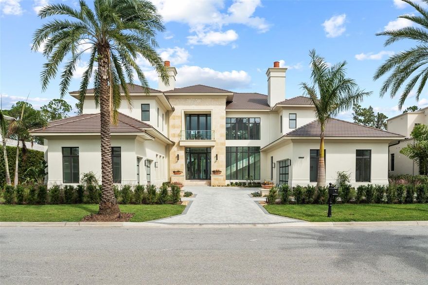 Presenting a stunning showplace of elegance and style nestled inside the coveted Four Seasons Private Residences Orlando within Golden Oak at Walt Disney World® Resort.  This exquisitely crafted estate home embodies all the magic of Disney with the unparalleled luxury and exclusiveness of The Four Seasons. A dramatic winding staircase with glass railings sets the stage for a grand experience unlike any other. Featuring a captivating Great Room with floor to ceiling windows under a soaring two-story ceiling, be impressed by the abundance of natural light and sparkling pool views that fill the room. The generous family room features sliding doors that open to reveal an enchanted patio with full summer kitchen and retractable screens for outdoor living. Two indoor kitchens – the main kitchen – and the Four Seasons catering kitchen with private access - are both perfectly suited to fulfill any culinary request. The primary retreat spans the north wing of the house and includes an extraordinary bedroom with honeycomb ceiling details, a spa-like bath with glass enclosed shower and separate soaking tub, plus exquisite walk-in closet. Upstairs access is provided by an elevator or two staircases – one of which is in the breezeway to access interior guest suite. Three second-floor bedrooms are all ensuite. Located just 4 miles from the Magic Kingdom Park, Golden Oak at Walt Disney World® Resort is a residential resort community where families can live in the embrace of luxury, privacy, and the magic of Disney. This gated community features distinctive neighborhoods of magnificent homes, expansive natural preserves, and inviting amenities—including Golden Oak’s private clubhouse, Summerhouse, with superb food offerings served in a casually elegant dining room, courtyards, pool area, fitness facilities, and family room. Additionally, as a Four Seasons Private Residences owner, you can enjoy an elevated lifestyle with access to the Four Seasons resort where your every wish will be granted. This exclusive enclave offers unmatched amenities combined with all the benefits and access provided by Golden Oak ownership, including Summerhouse, Golden Oak Member Services, theme park transportation, and additional exclusive resident-only benefits. The premier 18-hole Tranquilo Golf Course at the Four Seasons is located on-site and offers separate membership opportunities. Nowhere else can you live so close to the magic in a setting perfectly suited to create your own happily ever after.