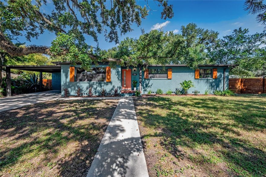 Tucked away in the heart of Old Seminole Heights, this completely restored mid-century modern dream blends timeless design with fresh, modern vibes. Just a short stroll to Publix, Hampton Station, Gangchu, and Three Coins Diner—and an easy walk to Lake Roberta—you’ll love being right in the mix of everything that makes this neighborhood special.

Step inside and feel the character instantly. Original hardwood floors run throughout, while the office (or bonus room!) steals the show with its tongue-and-groove cedar ceiling and preserved vintage tile. The kitchen was designed to honor the era—complete with terrazzo tile floors, a massive quartz-topped island, stainless steel appliances, and a built-in pantry with a pocket door.

The primary suite brings all the modern comfort with a marble-tiled ensuite and luxe gold fixtures. Two spacious guest bedrooms, a stylish guest bath, and a roomy laundry space make everyday living a breeze.

Everything’s new—electrical, plumbing, HVAC, roof, hurricane-rated doors and windows, and a sleek new horizontal fence wrapping the big backyard. There’s a massive two-car carport, plus an outdoor storage room for all your gear.

A true mid-century beauty—restored, reimagined, and ready for its next chapter in one of Tampa’s most beloved historic neighborhoods.