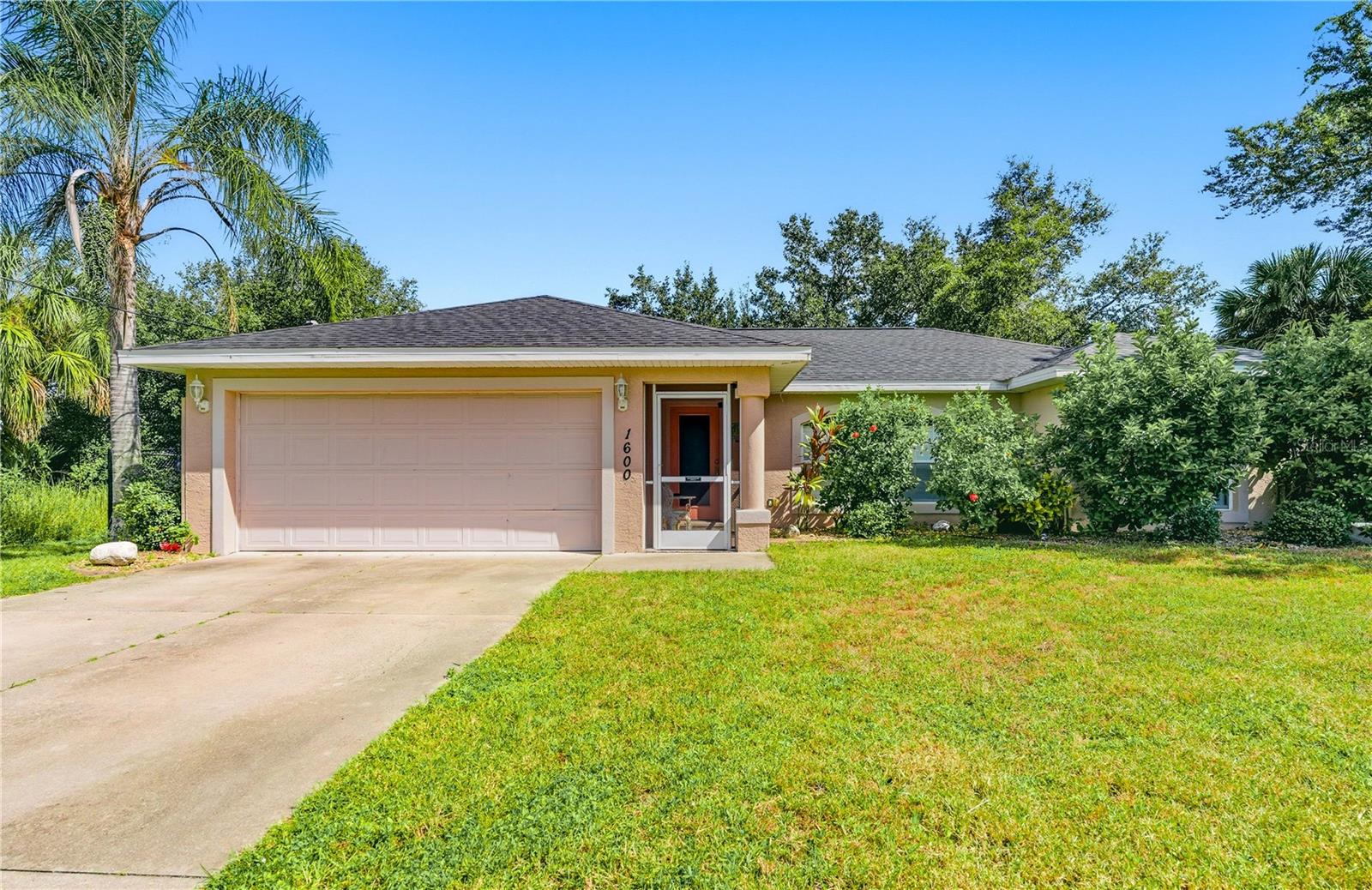Welcome to this beautifully maintained North Port home, perfectly situated on a spacious double lot (the lot is to the left). This property features a brand-new roof and gutters, recently replaced in October 2025. Step inside to find a light and bright interior featuring a split floorplan with tile flooring throughout. Enjoy the whole-house reverse osmosis system offering high-quality water for drinking and everyday use. Step outside to the beautiful in-ground pool, perfect for cooling off on warm Florida days, entertaining guests, or simply relaxing in your backyard retreat. The fully fenced yard offers privacy and security, making it ideal for pets, gardening, or outdoor gatherings.
Additional highlights include an irrigation system that keeps your lawn and landscaping looking vibrant year-round, and shutters for window protection, offering extra security and storm preparedness. The extra lot provides endless possibilities — whether you envision adding a detached garage, workshop, guest suite, or simply enjoying the added space for recreation and future expansion.
Located in a quiet, established neighborhood, this home offers the perfect balance of peace and convenience. You’ll be just minutes from shopping, dining, parks, schools, and easy access to I-75 for commuting or trips to nearby Gulf beaches. With its thoughtful upgrades, spacious layout, and desirable outdoor features, this property is a rare find in the heart of North Port. Don’t miss the opportunity to make it yours!