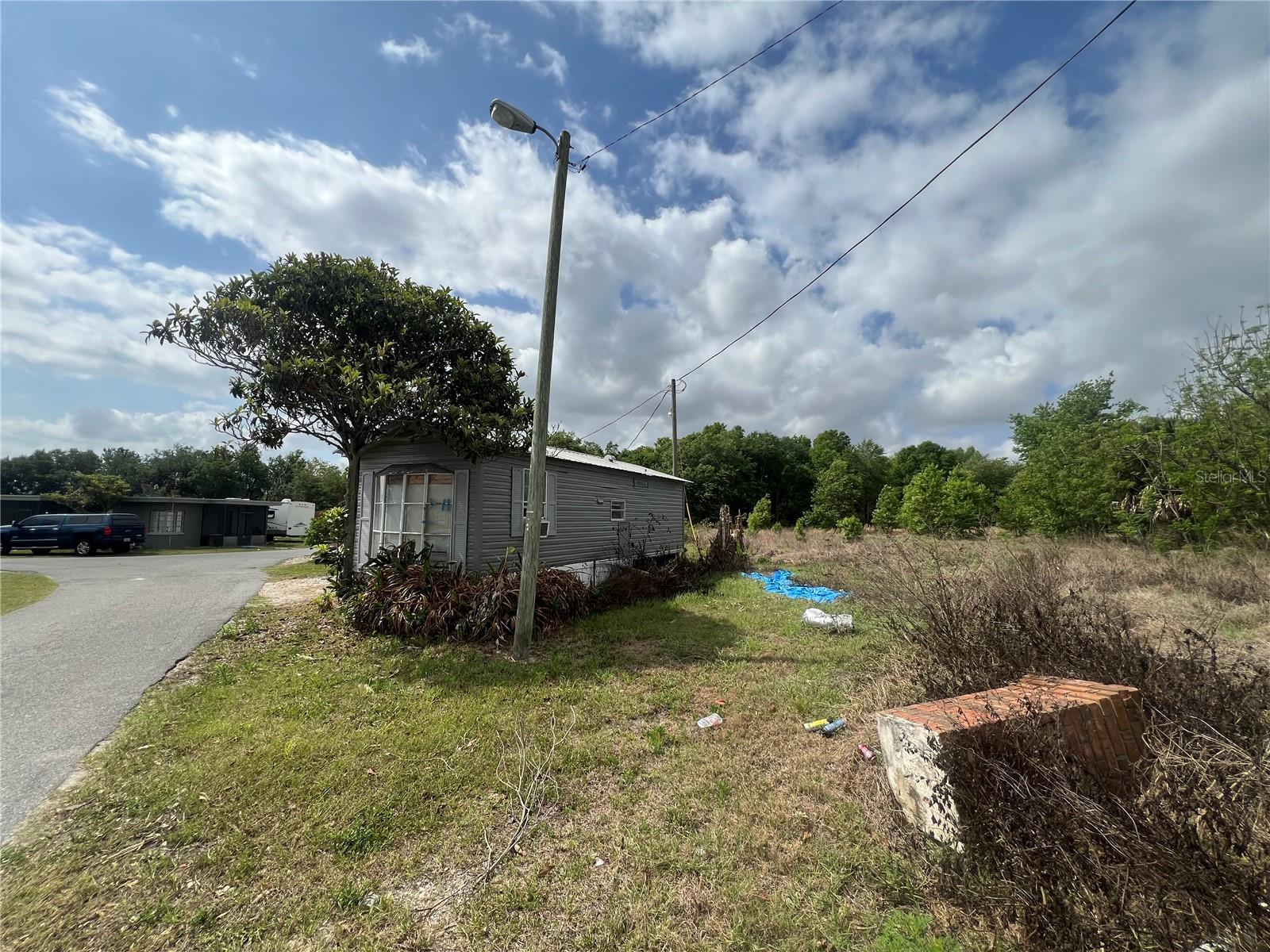 LAKE JOHNS MOTEL APTS. & TR. PK - Residential Income