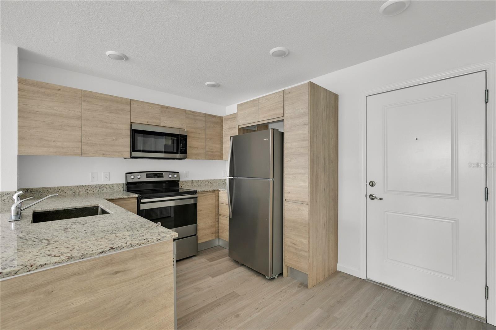 modern 2 bed 2 bath condo in prime Orlando location, Ground floor unit. Spacious and stylish condo featuring high ceilings, open layout, luxury vinyl flooring, modern kitchen with granite countertops and stainless-steel appliances, plus, in unit washer and dryer. convenient first floor unit with easy access. enjoy resort style amenities including pool, clubhouse, fitness center and sundeck. Pet friendly community! located across from the Sun Rail Station, just minutes from Florida mall, major highways, shopping, and dining. Great for homeowners or investor.
