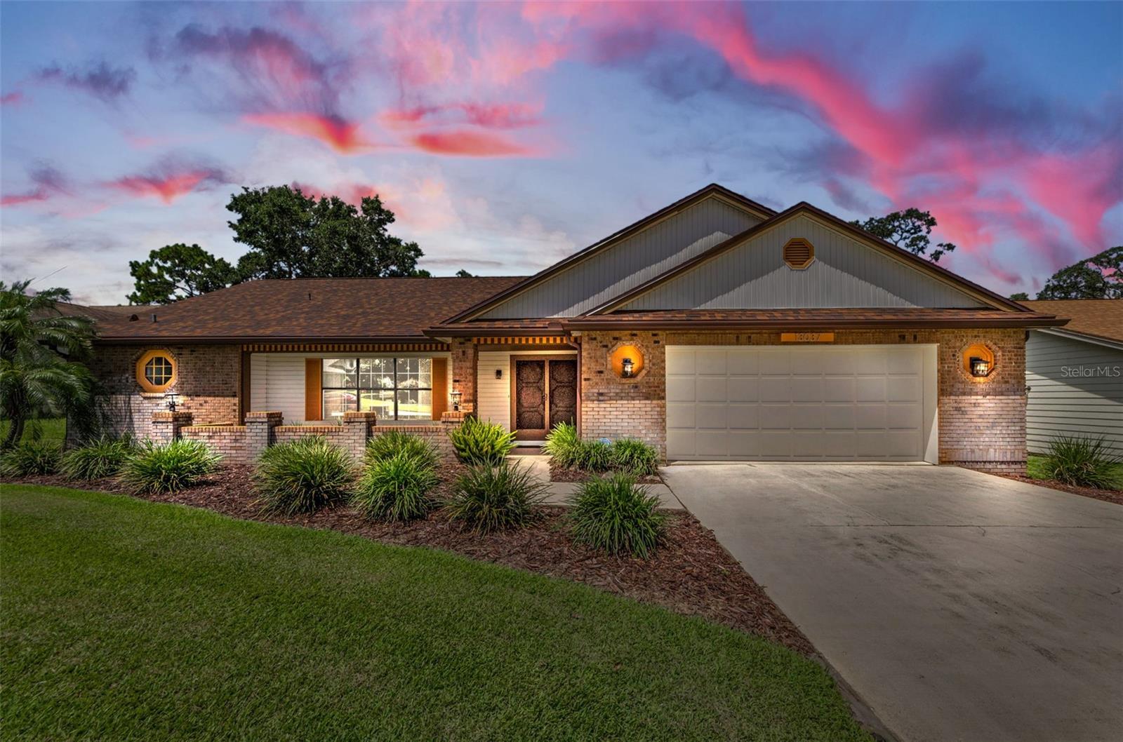 Beautifully Maintained Pool Home located in popular Greenside Village of Beacon Woods, A Golf Club Community in Pasco County. This Hearth Stone Model provides 2,015 heated square feet of living space with 3 bedrooms, 2 bathrooms, a true 2 car garage, screened enclosed pool and lanai overlooking a park-like setting with views of the 13th hole of the golf course. Features include neutral colors, carpet, tile, and luxury vinyl flooring, cathedral ceilings, lots of closets and storage space, inside laundry room, UV film on all windows, recessed lighting, window treatments, ceiling fans, security system, split floor plan, 5 sets of glass sliders that open to brick paved lanai, and screened pool: Spacious kitchen with soapstone counter tops, breakfast bar, built-in-desk, plant shelving, and eat in area - all appliances are included: the Primary Suite offers an roomy 11x12 Bathroom with his and her sinks, large shower stall, linen closet, and walk-in-closet. AC 2022 and 30-year Shingle Roof Replaced in 2023, Pool Heater 2024, Water Heater 2016, Orkin Pest Control Contract - paid through December, Rain Bird Sprinkler System on Well, and Water Softener. No CDD Fees! Low HOA Dues! Beacon Woods Civic Association provides a Club House, 18-hole Golf Course, heated swimming pool, fitness center, an auditorium for dances, entertainment, shows, speakers, cultural events, extra rooms for card games and monthly board meetings. The auditorium has a kitchen, can be rented by owners and residents for private parties and celebrations. Outside activities include tennis, bocce ball, and basketball courts, playground and picnic areas. Access to major roads for commute to Tampa and surrounding areas, close to shopping, restaurants, parks and 3 miles to the Gulf of Mexico.