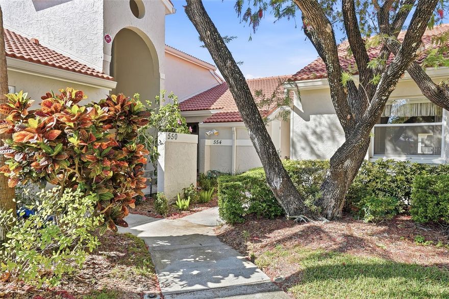 Tucked within the gated community of Placido Bayou, this beautifully renovated single-level 2-bedroom, 2-bath condominium offers the perfect blend of modern design and effortless living—truly living like a single-family home. With its own private entrance, a serene rear screened porch, and lush green space just beyond, this residence delivers both privacy and a peaceful connection to nature.

Inside, a completely open-concept layout is enhanced by soaring ceilings and abundant natural light, creating an airy, inviting atmosphere that feels both spacious and refined. The kitchen has been masterfully redesigned with custom cabinetry, a built-in desk with additional storage, and a beverage fridge—creating a space that is as functional as it is beautiful. For added allure, the entire home has been re-plumbed.

A rare and highly desirable feature, both bedrooms function as private ensuites, each offering its own beautifully appointed bathroom with luxurious step-in showers—ideal for guests or everyday comfort. An in-unit washer and dryer adds an extra layer of convenience.

Just steps from your front door, enjoy access to the community pool and spa—perfect for relaxing afternoons or a refreshing start to your day. Reserved and guest parking are conveniently located just outside the unit. Placido Bayou is known for its tranquil, nature-filled setting, with scenic lakes available for fishing, winding sidewalks for peaceful strolls, and charming lakeside benches that invite you to pause, unwind, and take in the beauty of your surroundings.

This is a unique opportunity to enjoy low-maintenance living without sacrificing space, privacy, or style—all within one of the area’s most sought-after gated communities.