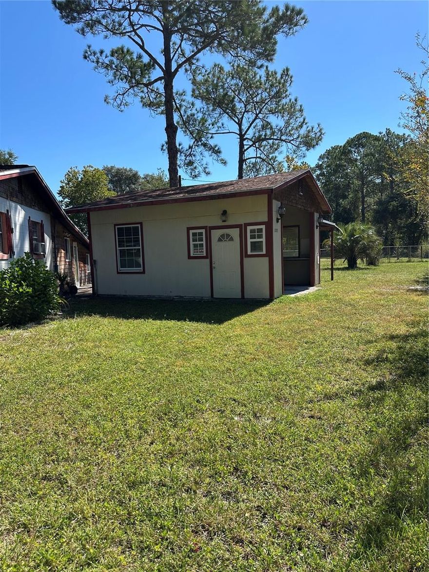 HUNTING, FISHING, QUIET AND PEACEFUL FLORIDA  SURROUNDINGS FOR YOUR NEW  HOME.  ALMOST 1/2 ACRE IN FORT MCCOY! ON A PAVED ROAD!!  Block home with a wonderful workshop, shed and fenced yard.  Great Potential!  2-bedroom, 1-bath home in a country-like setting.  Hardwood flooring and HISTORIC charm. The kitchen leads directly to a convenient laundry area. A Large bonus room with ceramic tile offers additional living space that can really be almost anything.  This property includes a well and septic system. Additional features include a large storage closet, a detached shed, and a workshop—ideal for all your toys and equipment. Bring your vision and transform this home into your idea retreat!  Whether you are looking for a Retirement Retreat, Hunting Camp or just some great Rural Living, this is potentially Your New Home!