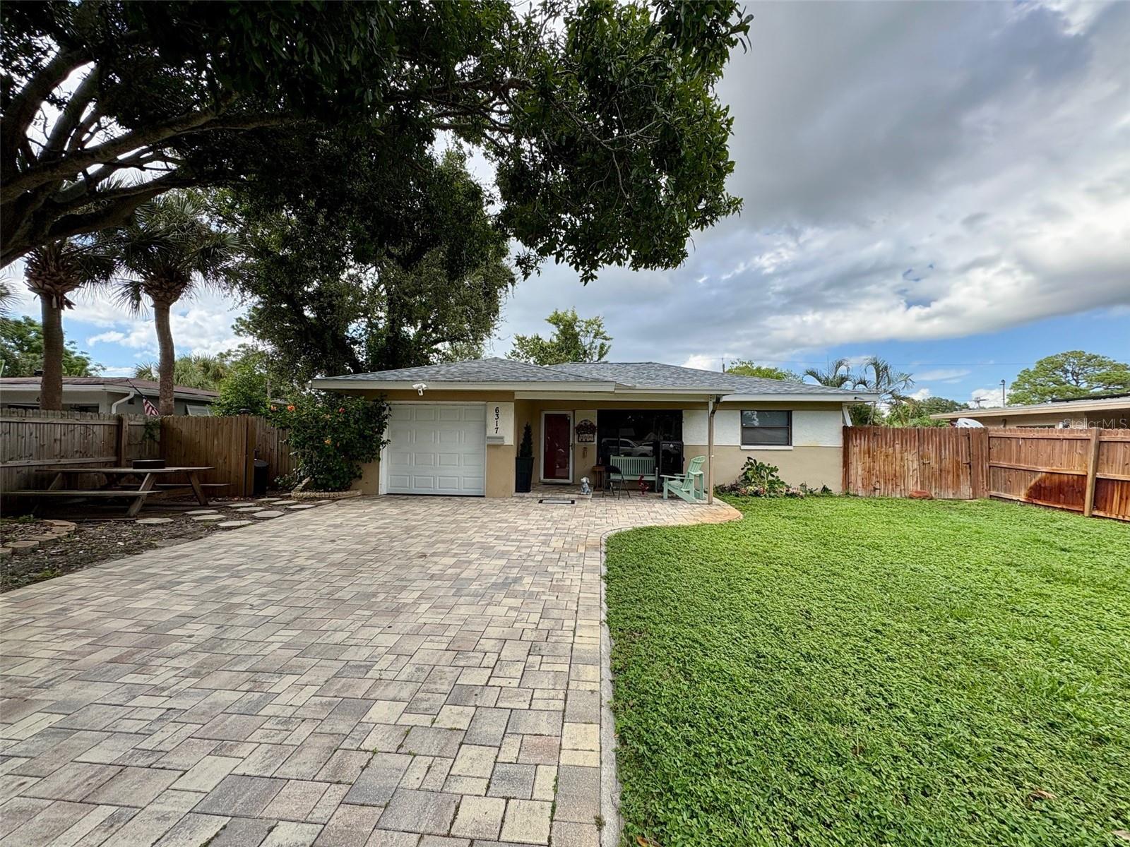 Only blocks from Tyrone Mall and shopping and dining district with several highly rated schools in the area. This house lies in the quiet, yet conveniently and centrally located, neighborhood in the Tyrone area. Open floor plan, great for those starting out or downsizing. Huge Lanai and fenced yard, paired with a nice, covered and brick paved front porch. Oversized driveway has nice, newer brick pavers. Updated roof (new as of 2018). Full size garage includes existing plumbing that could be converted into an additional half bath. No flood zone - high and dry during the recent hurricanes. Huge, fenced back yard. Aluminum covered screened in back porch with ceramic tile. Bonus room lanai off dining room (not included in measurements). House has great bones for adding on or expanding - making it your own! Perfect starter or retirement home, or for rental income.
Owner is broker. All room measurements are approximate, not to be relied upon.
Submit offers on FAR/BAR As Is Contract.