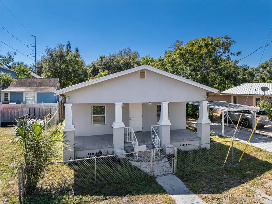 Experience the complete revitalization of this stunning 3-bedroom, 1-bathroom single-family home in a fantastic East Tampa location. Absolutely everything is brand new as of 2024, including the HVAC system, AC ductwork, roof, electrical, windows, and doors, ensuring peace of mind and worry-free living for years to come. The interior boasts an open-concept floorplan featuring durable, beautiful luxury vinyl plank flooring throughout. The kitchen is a true highlight, showcasing elegant white shaker style cabinetry, sleek quartz countertops, and new stainless-steel appliances. Outside, you’ll find excellent curb appeal with a welcoming raised and covered front porch. Practical features include a covered carport, a convenient storage shed, and a fully fenced lot.  This home offers excellent connectivity to the best of Tampa Bay! You'll enjoy easy access to major thoroughfares like I-4 and I-275 for a seamless commute. Quickly reach major attractions and amenities, including Downtown Tampa, Historic Ybor City, Seminole Hard Rock Hotel & Casino, and Busch Gardens Tampa Bay.
