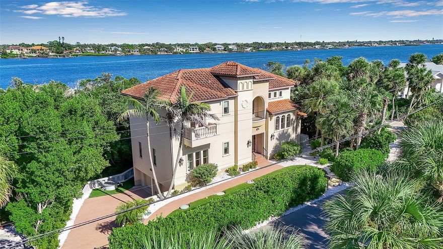 Beautiful Waterfront Home on Casey Key.  Experience coastal luxury in this beautifully crafted waterfront residence on exclusive Casey Key. Designed for effortless indoor-outdoor living, this open-concept home features a spacious great room with a decorative fireplace and a gourmet kitchen that’s an entertainer’s dream—complete with Viking Professional Series appliances, a walk-in pantry, and a large island.
Walls of glass open to the outdoor living area with a summer kitchen, balcony, and sparkling pool—perfect for entertaining or relaxing in style. Each of the four bedrooms features a private en-suite bath with TOTO and Kohler fixtures and designer finishes in natural stone, porcelain, glass, and metal.
The oversized primary suite offers exceptional comfort and privacy. Quality details abound, including hurricane-rated windows and doors, granite and marble countertops, 8-foot solid-core doors, crown molding, and elegant millwork. An oversized garage provides ample storage, and the home is elevator-ready.
Custom built to Florida Green Building Standards, this residence was thoughtfully designed to maximize environmental and energy efficiency. Enjoy the best of both worlds—a deeded beach easement to your own private stretch of Gulf sand and a deep-water dock on the Intracoastal Waterway for exceptional boating. Additional features include a whole-house generator and convenient proximity to downtown Sarasota, with its top-rated restaurants, and the charming town of Venice with boutique shopping, and waterfront restaurants and coastal charm.  Close to 3 major airports -- and a private airport in Venice.