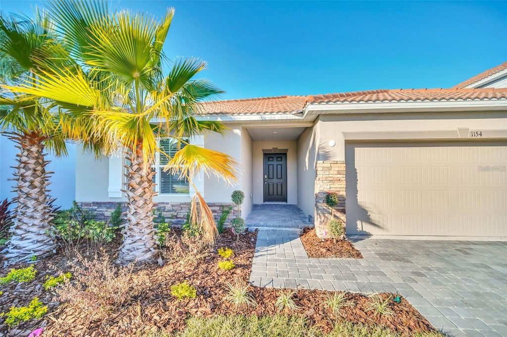 Photo of 1154 Oak Bluff Drive, Davenport, FL 33837 (MLS # O6382541)