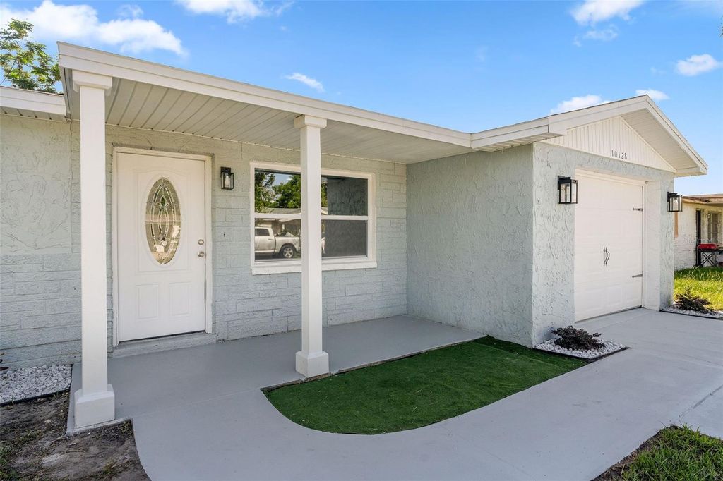 Photo of 10128 Cherry Creek Lane, Port Richey, FL 34668 (MLS # TB8422268)