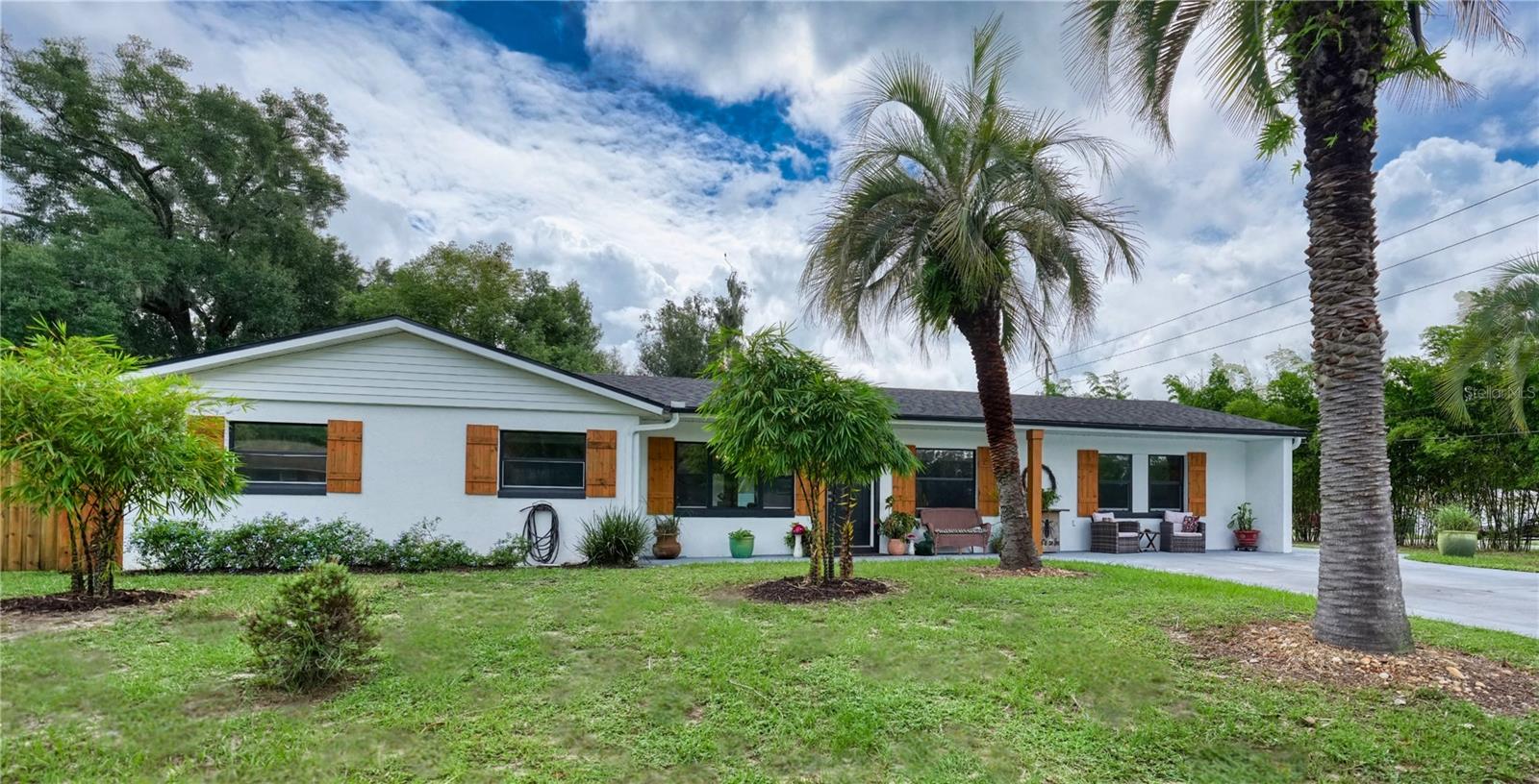 Deland Pool Home with Guesthouse - Over 1/2 Acre of Paradise!
Just a mile east of Stetson University and a hop from vibrant downtown Deland, this corner-lot gem sparkles with charm and modern upgrades. Nestled on over half an acre, the property has a oversized driveway and a 15 x 30 privacy wall surrounding the in-ground pool, freshly refinished in 2020 and powered by a brand-new pump (September 2025).
The main house has 3 bedrooms and 2 bathrooms, including a master suite with a rainfall showerhead. Step inside to an open floor plan where the chef’s kitchen steals the show: a commercial-grade refrigerator/freezer, a 48-inch gas range with double ovens, a massive island seating five, open shelving, an instant hot water tap, and a sleek plate rack. The adjacent laundry room shines with ample storage, built-in shelving, and a stackable washer/gas dryer.
A separate guesthouse offers endless possibilities with 2 spacious bedrooms, a full bathroom, and a bright, airy main space perfect for guests or entertaining.
Modern comforts abound: a gas tankless water heater fuels the main house, the A/C was updated in 2018, and the roof was replaced in 2021. The guesthouse enjoys a new A/C (2022).
This vibrant retreat blends style, space, and functionality—ready to make a splash as your forever home!