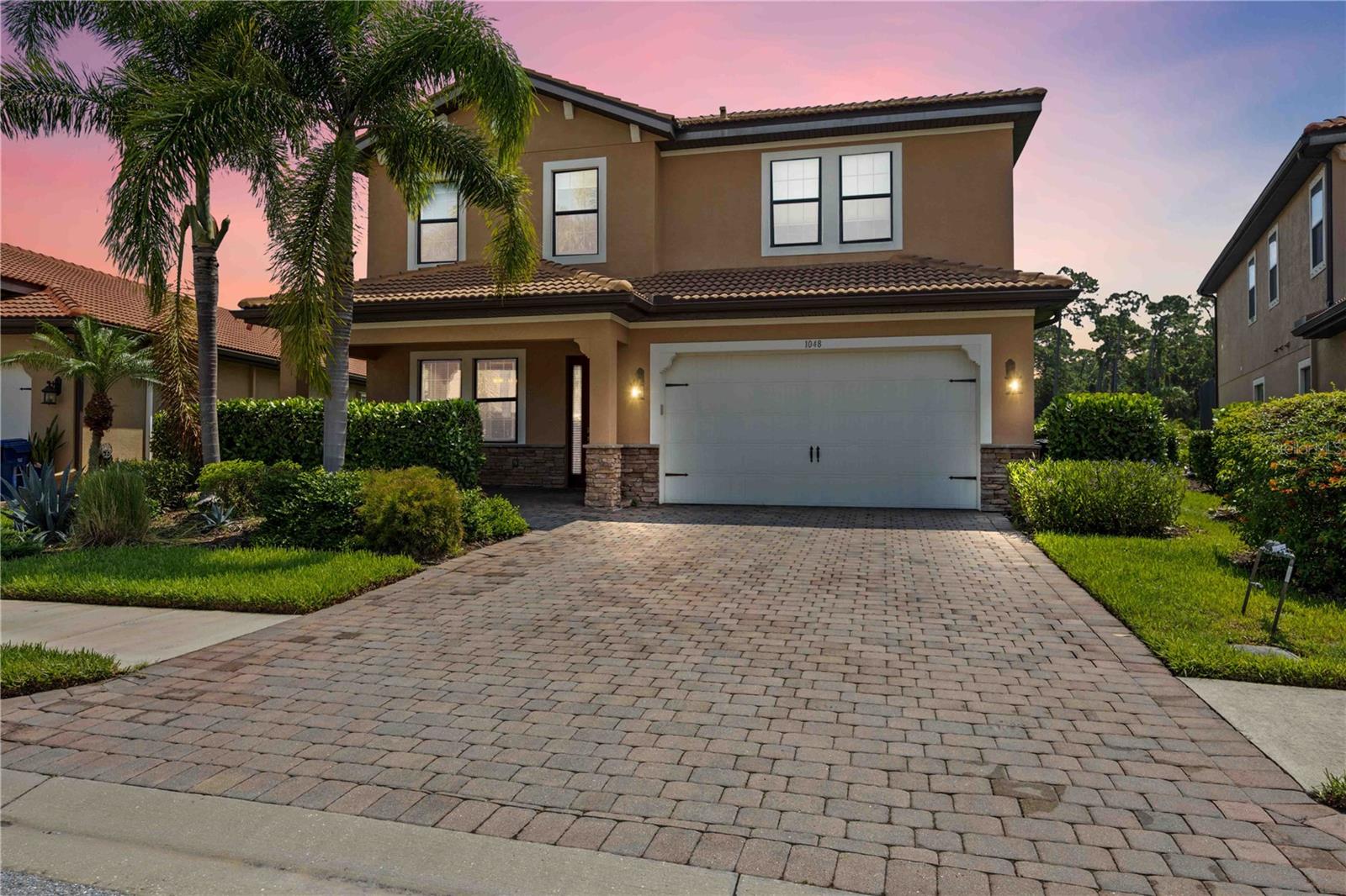 Just 2 BLOCKS from the Legacy Trail and 2 MILES from Nokomis Beach! Nestled in Calusa Park, a cozy gated community of 88 homes, this stunning 2015-built, 4BR/3BA home offers a perfect blend of luxury, comfort, and natural beauty. With 3164 square feet and two stories of thoughtfully designed living space, this residence is a true sanctuary. Step inside to be greeted by an expansive, open-concept floor plan featuring high ceilings, elegant finishes, and large, hurricane-rated windows that flood the space with natural light. The gourmet kitchen is a chef's dream, complete with granite countertops, stainless steel appliances, a massive island and incredible Butler's Pantry PLUS walk-in pantry that makes entertaining a breeze. The living and dining areas flow seamlessly, creating a perfect setting for gatherings of any size. On the first floor you'll also find a private Office/Den, as well as a Bedroom and full Bath. Through the triple-wide sliding glass door you'll find a private oasis, where a heated salt-water pool and spa await! The expansive lanai features pavers and hook-ups for an outdoor kitchen. Clear View screens give you an unobstructed view of a serene pond teeming with wildlife, providing a picturesque and peaceful backdrop for your outdoor activities. Whether you're relaxing in the spa, enjoying a swim, or simply taking in the stunning views, this space offers an unmatched level of tranquility. The upstairs features an Owner's Suite, with attached Sitting Room and to-die-for, fully customized Walk-In Closet. The Closet opens directly into an expansive Laundry Room (also accessible from the upstairs hall) complete with utility tub. A luxurious En-Suite Bathroom is the perfect finishing touch. A loft style Family Room, two large additional Bedrooms, two storage closets and a Full Bath with dual vanity provide ample space for family, all designed with comfort and style in mind. As a resident of Calusa Park, you’ll also have access to a sparkling community pool and enjoy complete lawn maintenance, included in the very low HOA fee. Nearby Laurel Park and Sandra Tims Terry Community Center feature a full complement of amenities and activities for everyone. With a 2-car garage, energy-efficient features, and a location that offers both incredible privacy and convenience, this home is truly a rare find! Don't miss your opportunity to live in a home where luxury meets nature in perfect harmony!