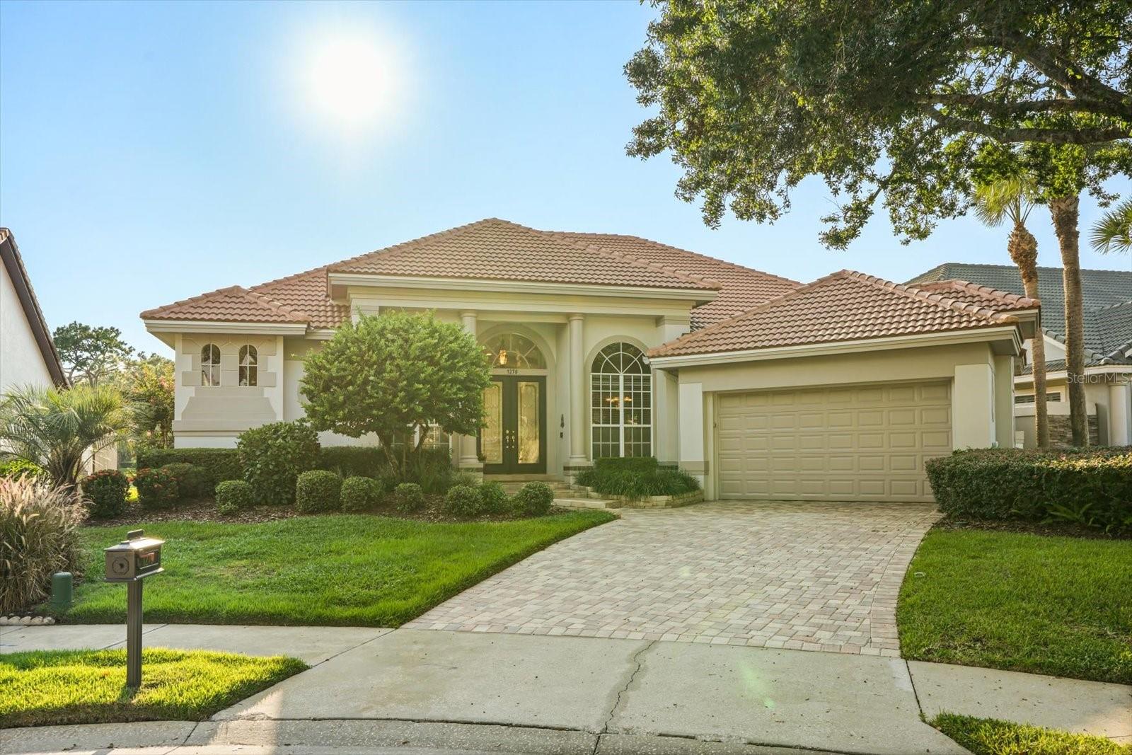 Tucked away on a quiet cul-de-sac in the desirable, guard-gated community of Heathrow, this Mediterranean-inspired Dave Brewer residence blends timeless design with resort-style living. Set on the 8th fairway, the home’s backdrop of rolling greens and tranquil water views creates a rare sense of privacy and serenity.
Inside, soaring 12-foot coffered ceilings, double crown molding, and custom architectural details fill the open floor plan with character and light. Wood and tile floors lead you through elegant living spaces designed for both relaxed living and effortless entertaining. The gourmet kitchen takes center stage with a central island, abundant storage, and seamless flow into the dinette and family room—complete with built-ins and a cozy wood-burning fireplace overlooking the pool.
The oversized primary suite is a true retreat with its own scenic views, a spa-like bath, and a custom walk-in closet. Three additional bedrooms provide flexibility for family or guests, while the expansive screened lanai invites year-round enjoyment with an outdoor kitchen, two-level travertine pool deck, sparkling spa, and Beadcrete pool.
Life in Heathrow means more than just a home—it’s a lifestyle. From Sawyer Lake Park with its sports courts, fields, and playground, to optional memberships at Heathrow Country Club offering golf, tennis, fitness, and dining, the community provides unmatched opportunities to stay active and connected. With top-rated Seminole County schools and convenient access to I-4 and 417, this address balances luxury, leisure, and location seamlessly.