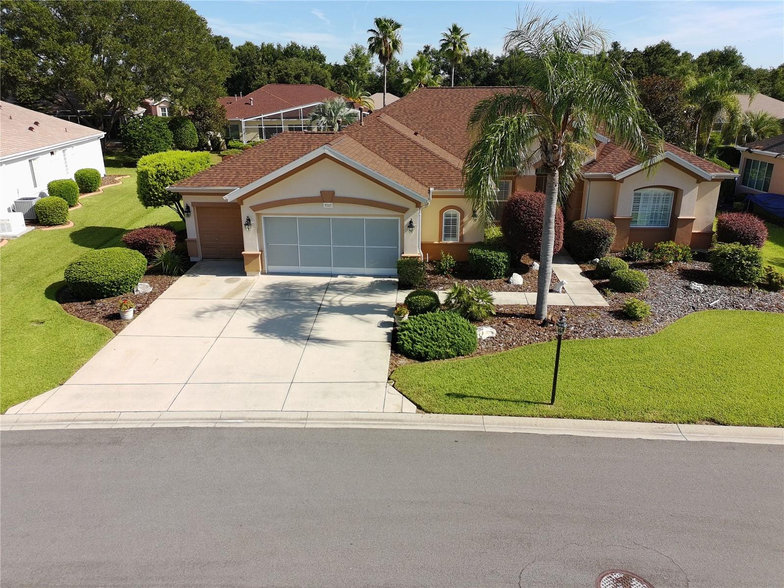 Stunning are the words you will use when you view this beautiful Hampton model that boasts three bedrooms and two and one-half baths, split bedroom plan, an extended garage area for storage, workshop, or golf cart parking with a screen. Large gourmet kitchen with Corian countertops and wood cabinets, built in double oven and microwave and a large pantry and oodles of cabinet space. Roomy inside laundry room. Some plantation shutters in the home and 5 " baseboards throughout. Extended screened lanai and luscious landscaping. Speaker system on lanai. Water heater replaced 2013, roof re-shingled 2020, All of this on a deep privacy landscaped yard in the Tamarron section which is located near fitness center and softball field and preserve walking path.