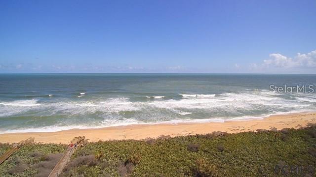 THIS EXCEPTIONAL OCEANFRONT HOMESITE LOCATED AT OCEAN HAMMOCK AND HAMMOCK BEACH IS A RARE FIND. SITUATED IN A PRIVILEGED NORTH END OCEAN RIDGE LOCATION, THIS 70 FEET WIDE LOT OFFERS UNPARALLELED PRIVACY. DESIGN YOUR DREAM HOME TO MAXIMIZE THE BENEFITS OF THE COMMUNITY SHARED WALKOVER ALREADY ESTABLISHED ON THE LEFT SIDE OF THIS PROPERTY (OR CONSIDER BUILDING YOUR OWN SHARED WALKOVER ON THE RIGHT SIDE). A HAMMOCK BEACH MEMBERSHIP IS AVAILABLE, GRANTING YOU ACCESS TO AN ABUNDANCE OF RESORT AMENITIES: 5 LAVISH POOLS, COMPLETE WITH A LAZY RIVER, WATER SLIDE, AND AN INDOOR POOL. ENJOY OVER 12,000 SQUARE FEET OF EXERCISE AND SPA FACILITIES TO INDULGE IN A DAY OF RELAXATION. DINE AT PRIVATE RESTAURANTS, PLAY A ROUND OF MINI-GOLF ON REAL GRASS, AND LET THE KIDS ENJOY THE KIDS-CREW PROGRAM, PROVIDING ENDLESS FUN FOR THE LITTLE ONES, ALONG WITH TWO CHAMPIONSHIP GOLF COURSES TO CHALLENGE YOUR SKILLS. (This is the last oceanfront lot available on this esteemed street in Hammock Beach!)