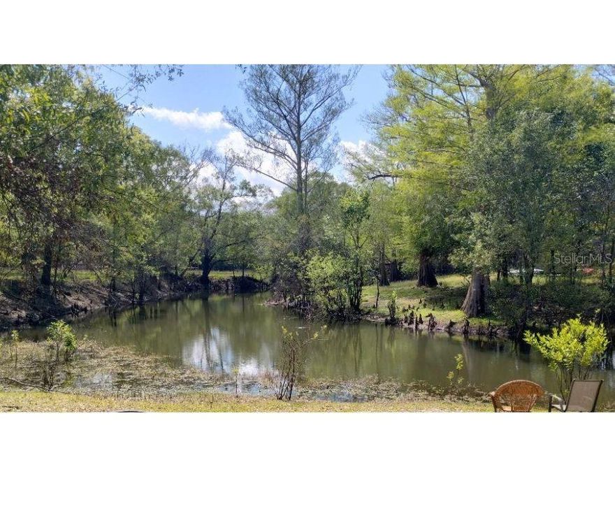 Discover the perfect canvas for your dream home or getaway retreat! This gorgeous vacant consists of three lots which span just over half an acre and sits directly on a peaceful canal off the Withlacoochee River. The property features two wells already in place, towering oak trees providing natural shade and beauty, and a small, picturesque creek running along the side. Whether you're envisioning a private escape, a fisherman’s paradise, or a nature lover’s haven, this unique piece of land offers endless possibilities.