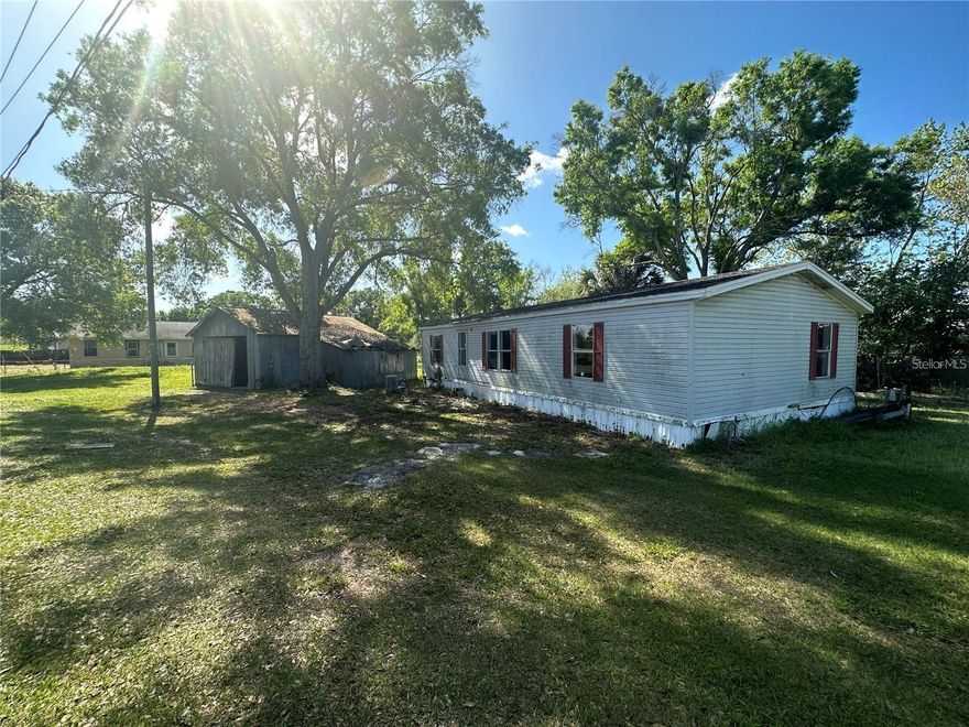 Located off the southwest side of Rifle Range Rd in Winter Haven, with easy access to Bartow, this property offers a quiet setting with plenty of potential. The existing mobile home has an approximately six-year-old roof and will benefit from updates, including subfloors and AC. Showings of the home are by appointment with an agent. Two additional structures on site offer added storage or future possibilities. No HOA. Buyers and buyer’s agents should verify all measurements, site details, land use, and tax information.
