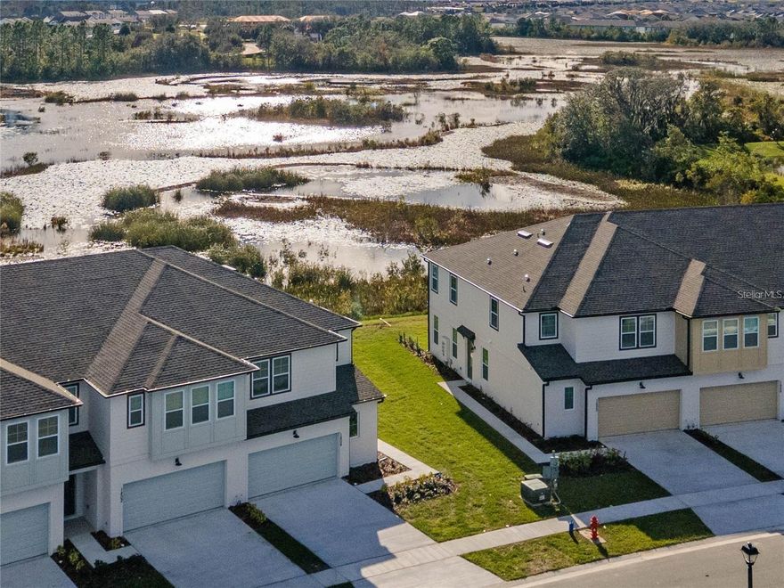 LIKE NEW END UNIT townhome with three bedrooms, two and a half bathrooms, and TWO CAR GARAGE for rent in the Championsgate. Only a short drive to Walt Disney World. Watch the beautiful Florida waterfowl from the water and conservation views from the front and back of the home. No rear neighbors! Community amenities include a resort-style pool, water park, fitness center, mini golf course, and beach volleyball court. Townhome has an open floor plan, high ceilings, lots of natural light, plank vinyl flooring downstairs, quartz countertops. Upstairs the spacious owner suite features dual sink, glass enclosed shower, and walk in closet. LAWN CARE INCLUDED in monthly rent.