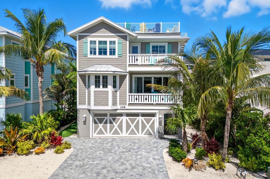 Where beach living meets everyday comfort. Perfectly located between the Gulf and the Bay, this 7-bedroom fabulous turnkey home offers water views, thoughtful updates, and easy access to the beach and Bridge Street shops, dining, and entertainment. It’s an ideal spot for enjoying island life or hosting visiting family and friends.

The main level features an open living, kitchen, and dining space that flows onto two covered balconies with Gulf and Bay views. Recent improvements include new appliances, updated lighting, designer living room and kitchen furnishings, upgraded WiFi, and a whole-house Sonos system—making the home feel fresh, functional, and move-in ready. Two ensuite bedrooms are on this floor, while four more ensuite rooms plus a den/office are upstairs, offering plenty of room and privacy.

Outside, enjoy your own private backyard retreat with new turf, mini golf, lush landscaping, landscape lighting, new gutters, and a mosquito misting system for easy care and extra comfort. The heated pool features a sun shelf, spa, and a fun waterslide—plus a pool chiller to keep the water comfortable year-round. Generous patio seating makes entertaining easy, and the new outdoor kitchen lets you cook and gather outdoors with ease. The outdoor shower is perfect after a long day at the beach.

At the end of the street, you’ll also find a shared day dock on the bay side — ideal for parking a boat, jet skis, or simply enjoying time on the water.

Cap it all off with a rooftop deck offering 360-degree views—a favorite spot for morning coffee or sunset cocktails.

Whether you want a full-time retreat or a high-demand rental opportunity on Anna Maria Island, this home delivers on location, lifestyle, upgrades, and space.