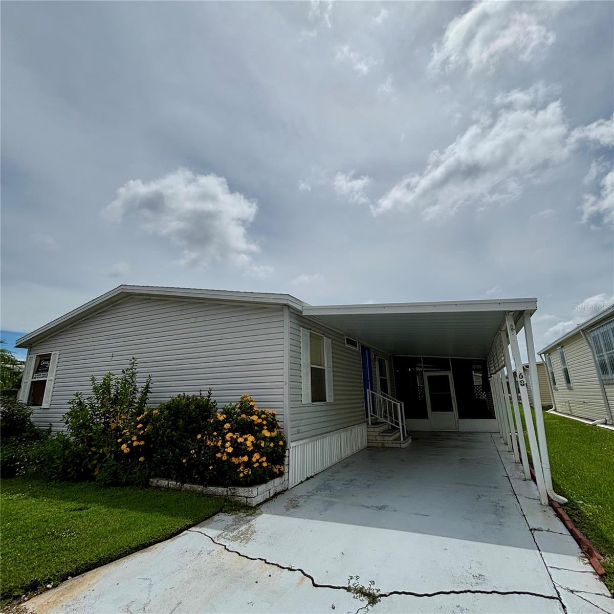 LAND SHARE COMMUNITY!! AFFORDABLE MONTHLY HOA 212.00 month
This lovely home was built in 1992 and has been meticulously cared for. Once entering the home you will experience the nice open concept of the Living and dining area with vaulted ceiling's.. Home has 3 bedrooms with a split floor plan . The kitchen is large and equipped with lots of cabinetry, Pantry, eat in breakfast area along with washer and dryer area as well. Master bedroom is good size with dual closets. Master bathroom has a newer walk in shower, double vanity with enclosed toilet area. Guest Bedrooms are on the other end of the home creating extra privacy for the guest.A extremely nice feature this home has is the large covered screened in area just off the kitchen, this area will be your favorite place to hang out with friends and family, great for entertaining playing cards ,or watching ball games . You can enter this area from covered carport also.Covered Carport can hold 2 cars.
You will enjoy the workshop/shed in back of home for extra storage.
NEW ROOF INSTALLED DEC 2024
VAPOR BARRIOR INSTALLED 2022
3 TON CENTRAL HEAT AND AIR
This home includes a share with an Affordable Hoa fee of 212.00 a month. Home is located directly across from the Beautiful Pool and clubhouse. Location is close to Sunny Beaches, Great Restaurants, Airports. Va Hospital..
Once again home has been well cared for and I can assure you it will not dissapoint.