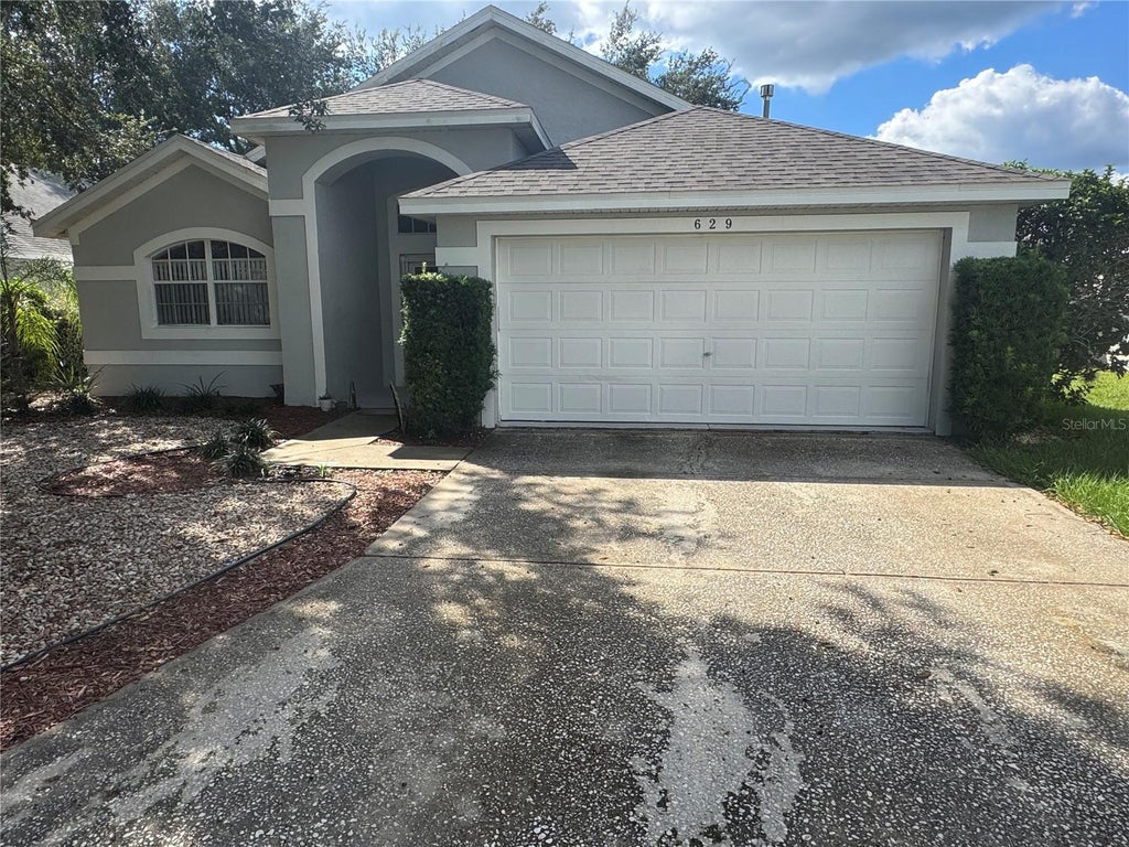 Photo of 629 Garberia Drive, Davenport, FL 33837 (MLS # P4940181)