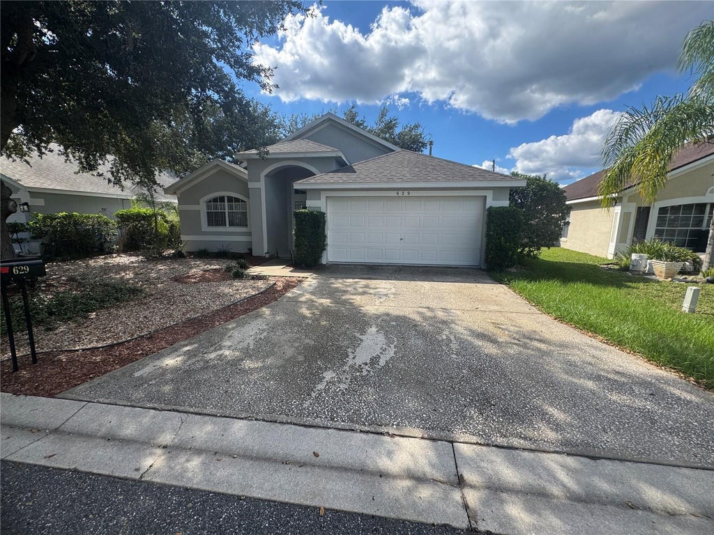 Photo of 629 Garberia Drive, Davenport, FL 33837 (MLS # P4940181)