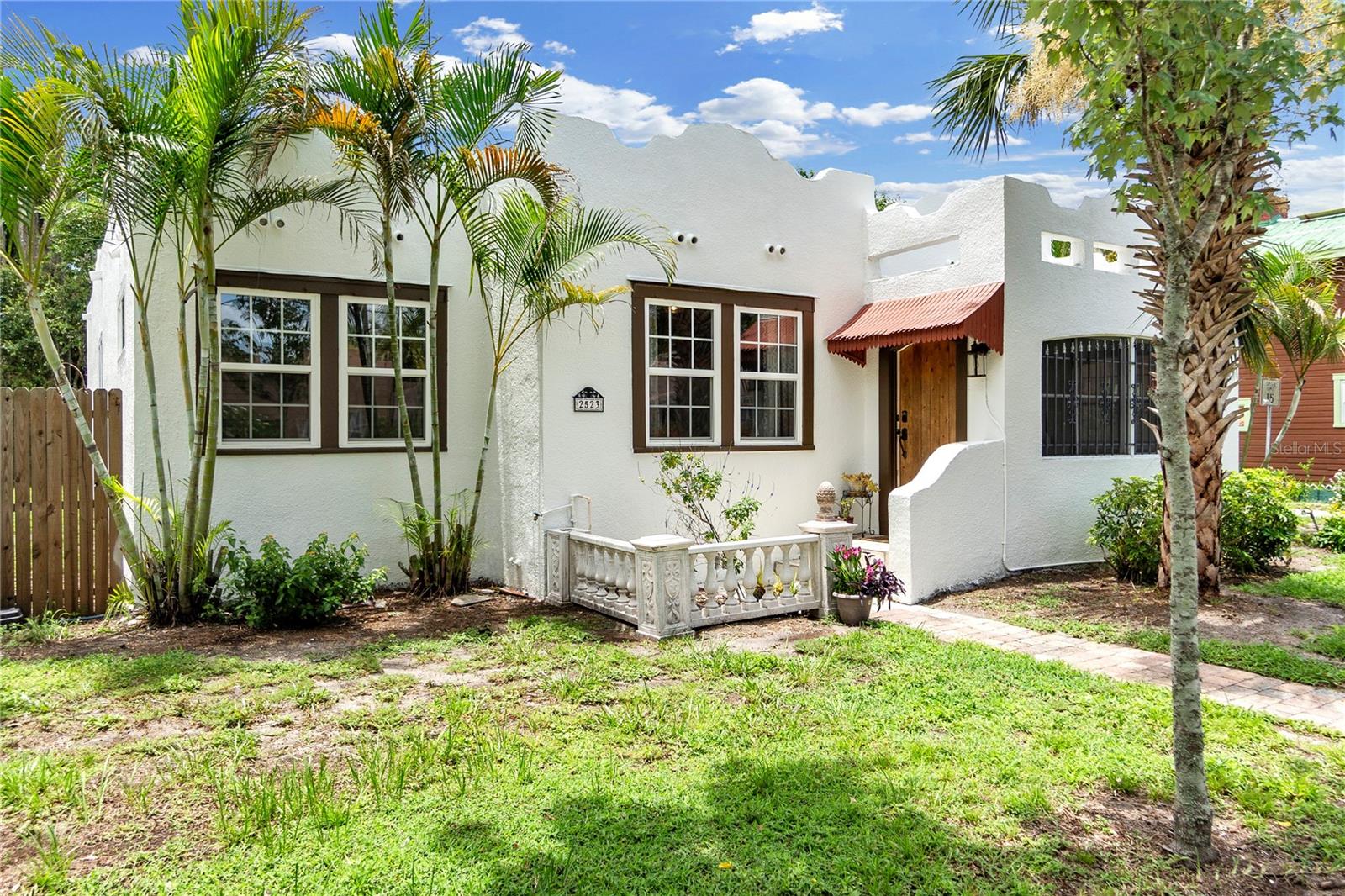 Where elegance, history, and location come together beautifully, an ideal combination of historic living and modern convenience. Step into this one-of-a kind historic 1925 Spanish Mediterranean that has been beautifully remodeled with custom touches throughout while still keeping true to the sophisticated charm and timeless character of the roaring 20s. Embracing the elegance of the 20s while seamlessly blending the modern updates featuring an open floorplan with wood brace beams, tall 10 foot ceilings, fireplace in the living room, a custom built kitchen with unique concrete stained counter tops, accents of Tiger wood, a farm sink, stainless steel appliances, tile backsplash, open wood shelving, beaded T&G wood ceiling, custom wood hood, a built in pantry and Mexican Saltillo tile. The owner's suite and owners bathroom were done as a new addition, permits in 2020. The owners bathroom features double sinks handmade in Poland, stained concrete counters, clawfoot soaking tub, separate tiled shower nook, tiled knee walls, tile floors, and a dual flow toilet. There is a tankless water heater just for the master bath so you will never run out of instant hot water. There is also a huge walk-in closet in the owners suite. Main electric panel 2019. HVAC 2018. Plumbing completely re-piped. Sewer line 2014. Water heater #1 2016 water heater #2 2019. HVAC 2018 The exterior of the house was painted July 2025. There is a large wood deck off the back of the home which is perfect for entertaining and overlooks the spacious backyard which is sprinkled with orange, lemon, peach and Florida avocado trees. If a pool is what you desire, there is plenty of room to build something spectacular. There is a two car tandem parking pad in the back of the home which is situated in front of the storage shed. This one-of-a kind historic home is nestled in the heart of Bradenton, just minutes from where the Riverview Neighborhood and Fogartyville meet, a few blocks from the scenic Manatee River, and the Historic River District. Perfectly situated on high and dry land in an X zone outside of a non preferred flood. With no HOA or deed restrictions, this property offers true freedom and flexibility for homeowners and could be used as a lucrative opportunity to generate income. This neighborhood is quaint, charming, full of character and minutes from downtown Bradenton offering vibrant shopping, dining, and entertainment options. Convenient access to the surrounding thriving cities of Anna Maria Island, Bradenton Beach, Parrish, St. Pete, Sarasota and only 25 minutes from SRQ Airport, this home provides convenient access to the best of Florida’s Gulf Coast. This is a rare opportunity that you don't want to miss. Schedule your tour today.