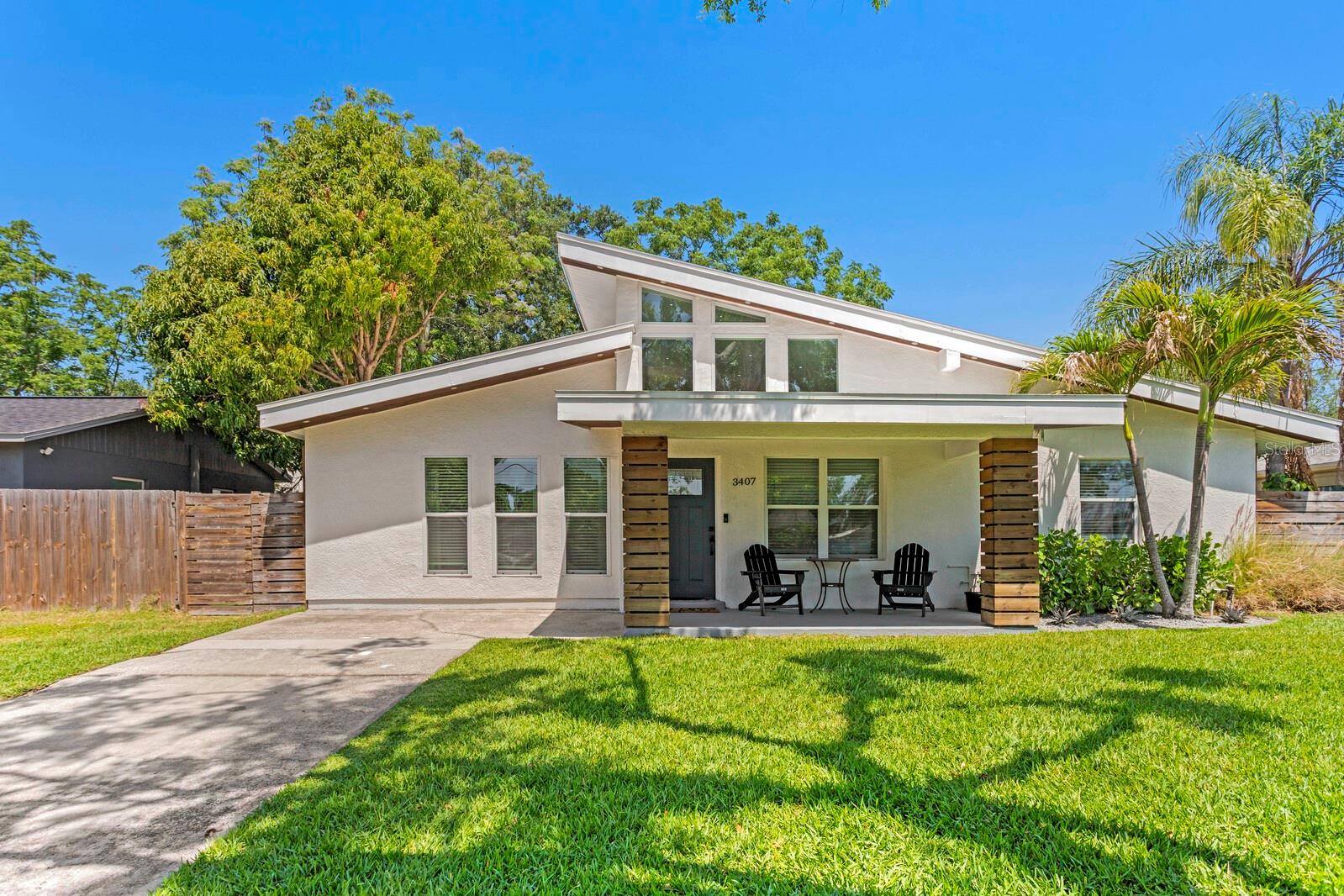 This beautifully renovated mid-century modern home is a rare blend of timeless design and cutting-edge energy efficiency. Inside, you'll find a bright and open layout with vaulted ceilings, split-bedroom design, and premium finishes throughout. The heart of the home is the chef-inspired kitchen featuring an oversized peninsula, granite countertops, solid wood white cabinetry, and energy-efficient appliances—perfect for entertaining. Dual sets of French doors open directly to the newly turfed backyard, enhancing the indoor-outdoor flow. With a Home Energy Rating System (HERS) score of 50 -this home is 50% more energy efficient than a standard new home. You truly won’t find another home on the market like this one. Additional upgrades include: 22.5 SEER mini-split AC units, Tankless water heater, Low-voltage LED lighting, Interior laundry with washer and dryer, Modern European-style bathrooms. The spacious primary suite offers a large walk-in closet and serene privacy. The exterior is equally impressive with a custom new front façade. Best of all—no flood insurance required, and enjoy lower homeowners insurance thanks to the high-performance construction. This is not just a renovation—it’s a smart, sustainable lifestyle upgrade.
