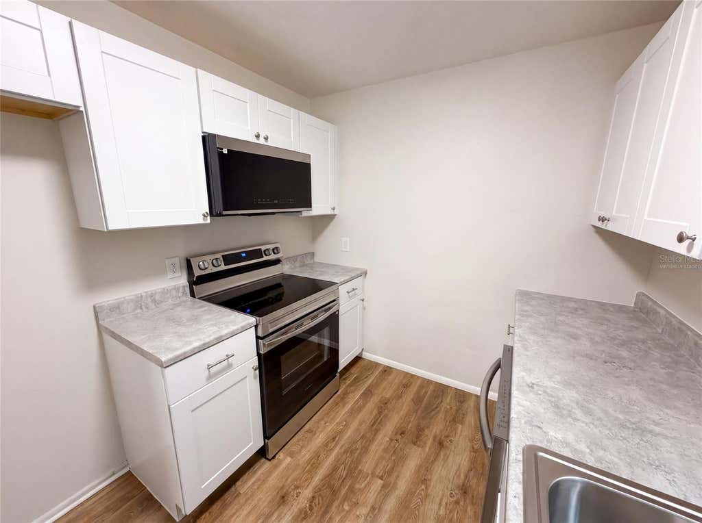 Photo of 8310 Rolling Log Drive, Orlando, FL 32817 (MLS # O6432867)