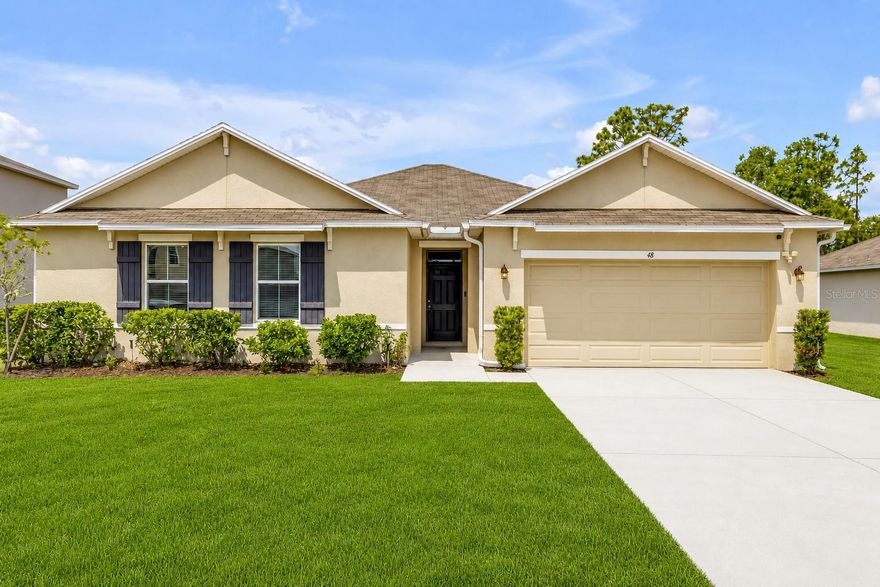 Golf course views, gated community, and a kitchen that stops you in your tracks. This beautifully designed 4-bedroom, 2-bath concrete block home delivers 2,820 sq ft of one-story living with the kind of details that make buyers fall in love before they even reach the back patio.
The open-concept layout flows seamlessly from a showstopper kitchen — granite center island, dark espresso cabinetry, granite counters, a pantry, and every appliance included — through elegant arched doorways into bright, airy living spaces with warm luxury vinyl plank flooring. A chandelier anchors the dining area with just the right touch of elegance. Step outside and the large covered patio faces the golf course directly — wide open, green, and peaceful. This is the view you moved to Florida for. The owner's suite is privately tucked at the rear of the home with a double vanity, walk-in shower with built-in shelving, and a generous carpeted walk-in closet. The guest bath is equally upgraded with its own double vanity and tub/shower combo — rare at this price point. The laundry room comes with washer and dryer included.
Curb appeal is on point: chocolate shutters, bold chocolate front door, clean landscaping, and a well-established gated community with wide streets and generous lot spacing visible from the drone.  One story. No stairs. Move-in ready. Everything stays. Schedule your private showing today.
