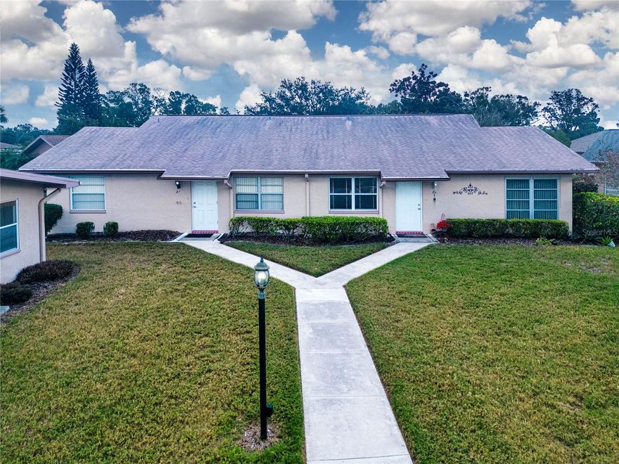 Explore this condo opportunity nestled in one of the "PET-FRIENDLY" neighborhoods within KINGS POINT, a well-loved gated community. Laminate flooring graces the Living Room, Dining Room, Hall, and both Bedrooms, while the Kitchen, Baths, and Florida Room boast tasteful tile. The Kitchen adds a touch of warmth with a lovely earth-toned Tile Backsplash.

The spacious Florida Room is perfect for gatherings or unwinding. The Primary Bedroom features a generous walk-in closet, and the Primary Bathroom offers a tiled shower. Convenience is key with an inside Laundry room and an attached double-door golf cart room for extra storage. Noteworthy updates include replaced plumbing and electrical panel.

Kings Point, a highly sought-after gated community, offers resort-style amenities such as pickleball, bocce, tennis, golf, a state-of-the-art Fitness Center, and so much more. Centrally located and an easy drive to Brandon, Tampa, Bradenton, Sarasota and St. Pete. Close to award-winning beautiful beaches, some of the world's best fishing, Tampa's cruise port, and Disney!  If you're seeking a true retirement haven, look no further—come bask in the Florida sunshine!