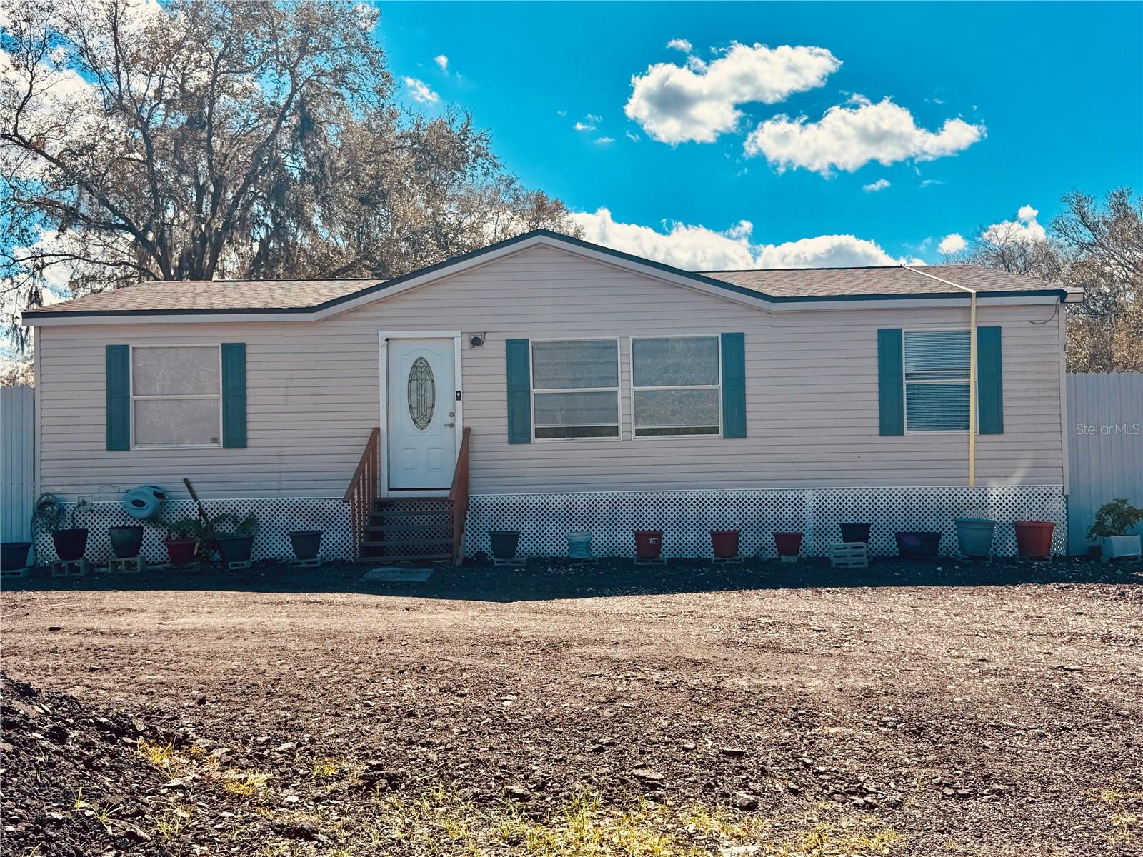 Spacious manufactured home situated on a generous 1.16-acre lot in unincorporated Orange County. This property offers a blend of privacy, space, and potential, ideal for those seeking a peaceful setting with room to grow. The expansive lot provides ample space for outdoor activities, additional structures, or future improvements. The home features a solid structure and utility-ready layout, with recent updates reflected in its market valuation. Located in a quiet area with no HOA, this property is perfect for buyers looking for flexibility and freedom in land use, while still being within reach of major roads and Orlando conveniences. Great opportunity for homeowners, investors, or developers.