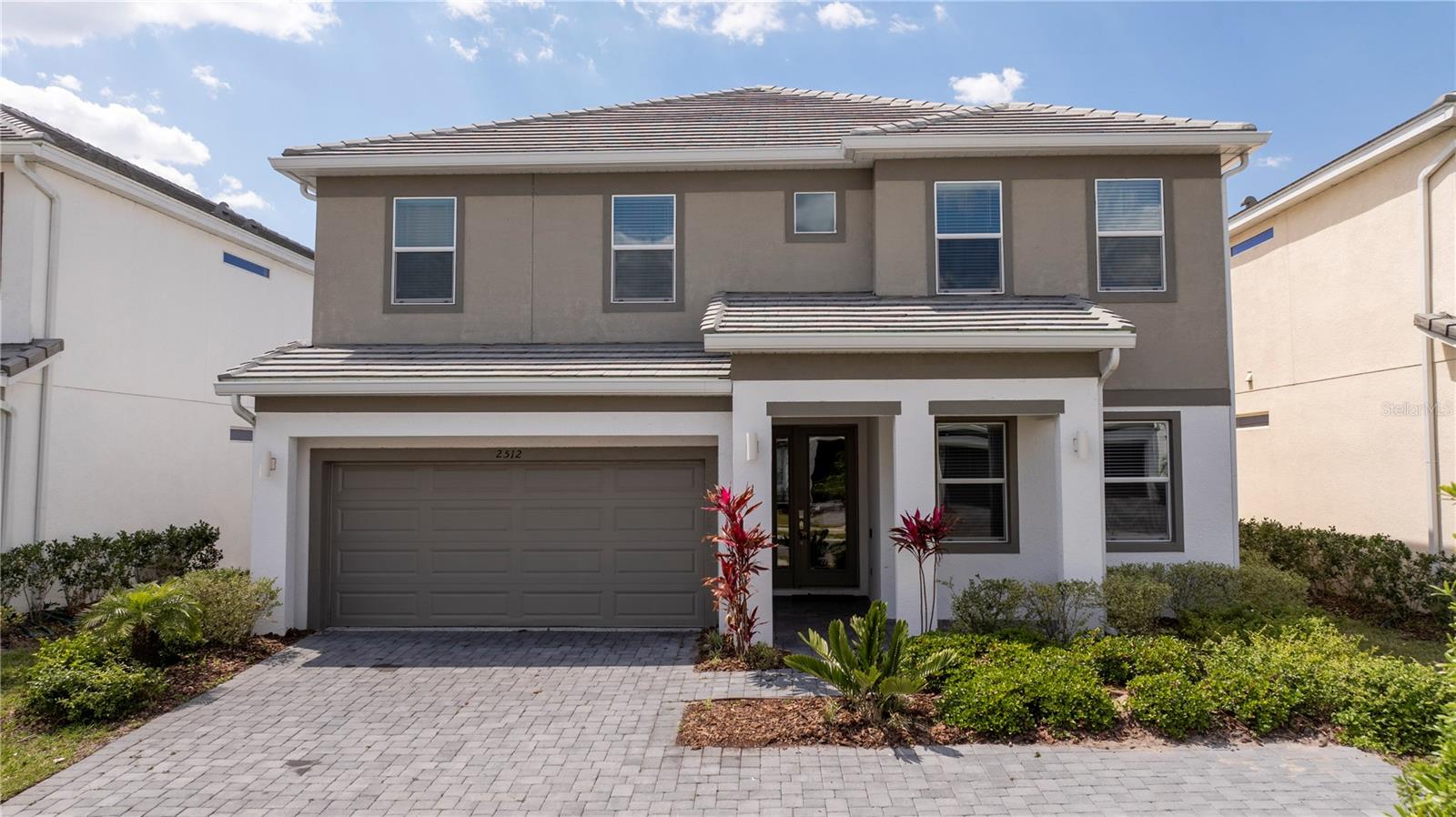 Welcome to this stunning 9-bedroom, 7.5-bathroom home in the gated Veranda Palms community—just minutes from Disney and Central Florida attractions. Over $150,000 in renovations have been completed, making this property truly move-in ready and turnkey. Designed for comfort and entertainment, it features two master suites, two laundry rooms, a loft-style movie theatre, and a converted air-conditioned garage game room. The gourmet kitchen boasts granite countertops, stainless steel appliances, two refrigerators, and two dishwashers. The first floor and stairs feature no carpet for easy maintenance, adding convenience and durability. Step outside to a screened-in heated pool and spa overlooking a serene pond, perfect for relaxation or gatherings. Conveniently located near shopping, dining, and major highways, this fully furnished home is great for short-term rental investment with strong income potential, a secondary home, or even a primary residence. NO CDD and LOW HOA! Community amenities include a clubhouse with resort-style pool, hot tub, splash area, fitness center, and walking trails. Don’t miss this opportunity—schedule your private showing today!