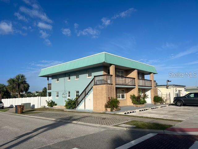 Discover the ultimate Flagler Beach lifestyle in this beautifully renovated 1-bedroom, 1-bath condo just two blocks from the iconic pier! Located in the heart of downtown, this coastal retreat features front and back balconies overlooking a fully fenced backyard with a paver patio and firepit—perfect for relaxing or entertaining. Inside, enjoy a bright and modern interior with fresh finishes throughout. The unbeatable location places you steps from the beach, local restaurants, shops, and everything Flagler Beach has to offer.