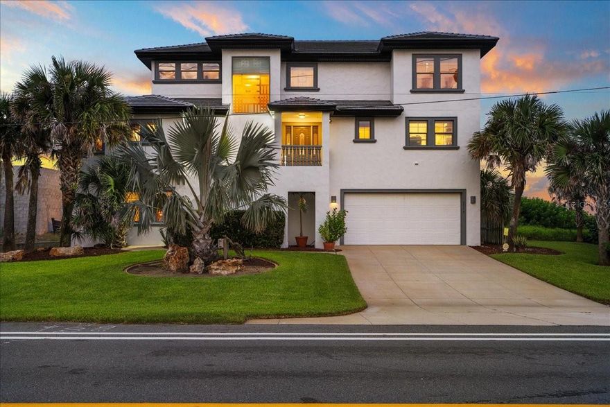 Flagler Beach OCEANFRONT Masterpiece – Where Elegance Meets the Shoreline!! Wake up to the sound of waves and endless Atlantic views in this custom-built three-story oceanfront home with 3 bedrooms, 3.5 bathrooms and a separate office. Thoughtfully designed with quality finishes and direct beach access, this residence offers the rare chance to own a true oceanfront home with space for entertaining, relaxing, and working from home. The main living area on the second floor showcases an open floor plan with walls of windows framing the ocean. A gourmet kitchen with granite countertops, center island and custom cabinetry flows seamlessly into the dining and living spaces all opening to an expansive oceanfront balcony—perfect for hosting friends or enjoying quiet mornings by the water. The primary suite features private balcony access, dual vanities, a spa-inspired bath and a huge custom walk-in closet. Upstairs, two bedrooms, a loft and a seprate office all enjoy sweeping views. The first-floor bonus room with wet bar is ideal for a game room, gym or in-law suite. Multiple decks, patios, and a private dune walkover with viewing platform put the beach just steps from your door. Extra features include a built-in gas fireplace, dual A/C units, water softener, irrigation, and security system. With no HOA restrictions, oversized living spaces and private beachfront access, this home is ready to enjoy today—or customize to your personal style. Schedule your exclusive showing today!
