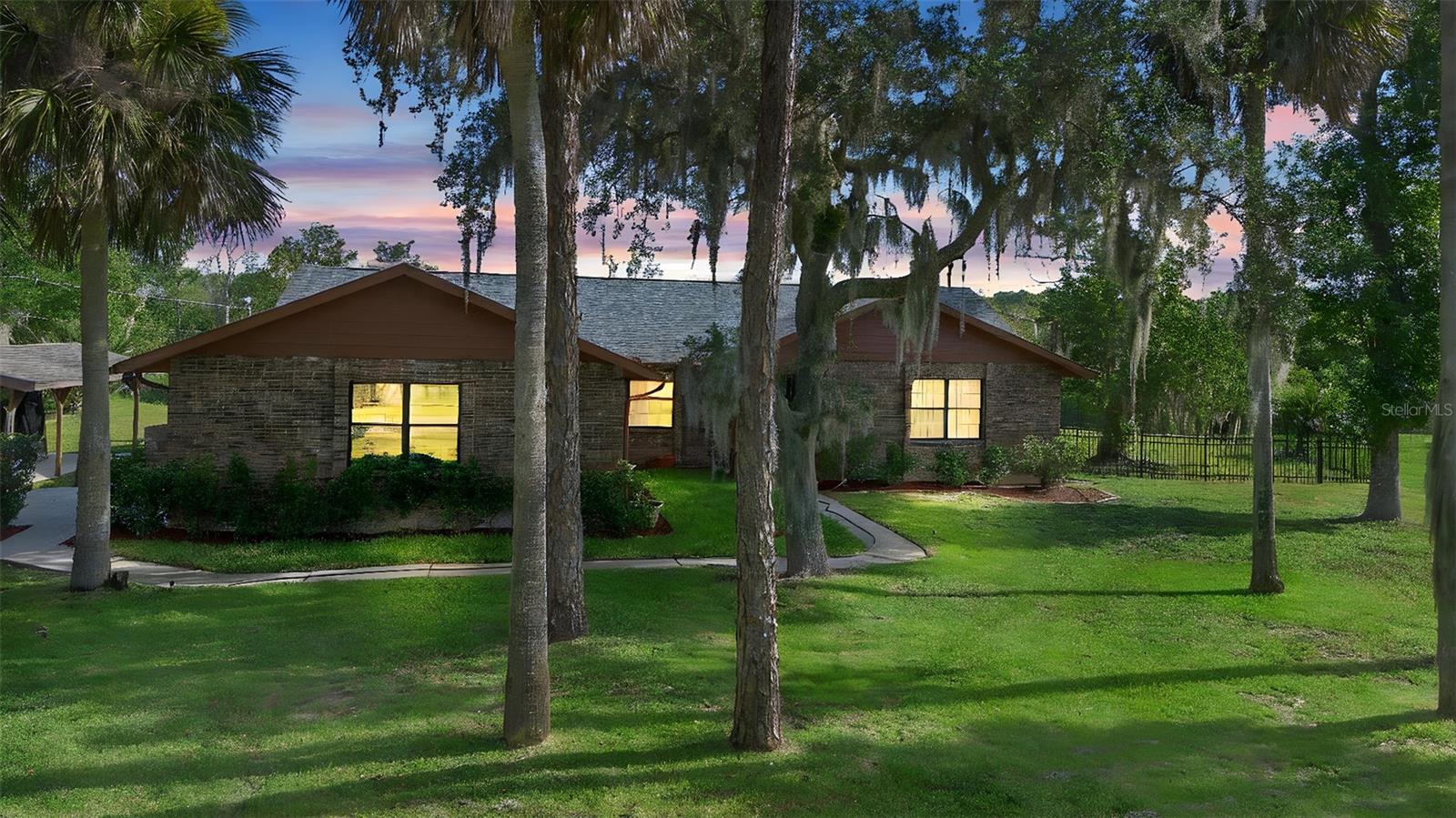 Completely updated and move-in ready, this stunning lakefront property offers the ultimate in waterfront living! Enjoy direct access to the water with your own private boat dock and boat lift—ideal for boating, fishing, and soaking up the sun. Inside, you'll find a beautifully renovated home with modern finishes throughout, including new flooring, upgraded kitchen, stainless steel appliances, and remodeled bathrooms. Large windows bring in natural light and breathtaking views of the lake, while the open-concept layout is perfect for relaxing or entertaining. Outside, unwind on the spacious deck, gather around the firepit, or head straight to the water. Whether you're looking for a full-time residence or a weekend retreat, this is lake living at its finest!