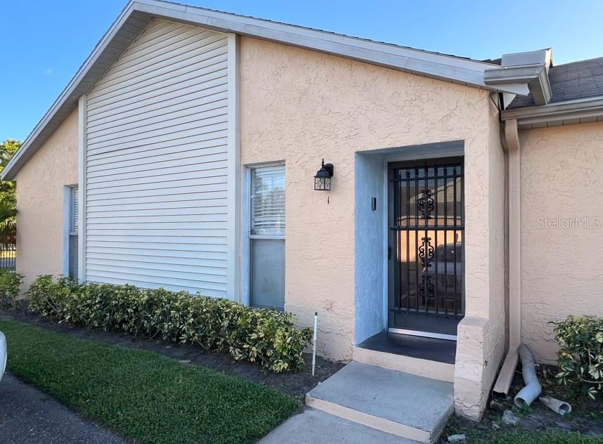 This charming 3-bedroom, 2-bathroom villa is the perfect place to call home. Featuring tile floors throughout the living areas and kitchen, this property offers both style and easy maintenance. The bedrooms boast comfortable flooring, while the interior screened back patio provides privacy and can double as a convenient storage space. Unwind with a refreshing dip in the community pool after a long day of work or place. Located just 30 minutes from Walt Disney World Resort, 15 minutes from Osceola Hospital, 3 minutes from Publix, and 5 minutes from CVS, Aldi, and local restaurants, this villa offers unparallel convenience. It's also close to major attractions, fantastic shopping, and wonderful dining options, making it an ideal location for work, life, and leisure.