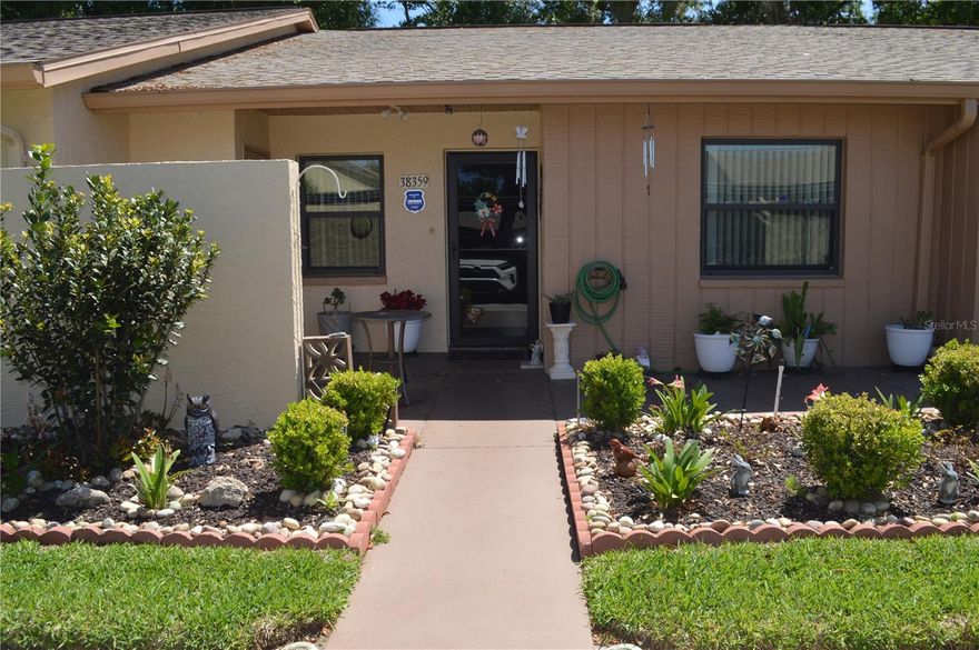 Welcome to Driftwood Condominiums, a Wonderful 55+ GATED Community, with lots of Clubhouse Activities daily/weekly -  inclusive of a heated pool, shuffleboard courts. This move-in ready  condo has 2 bedrooms and 1 bathroom and has been meticulously maintained, with upgraded granite countertops, newer flooring, and newer appliances..  

The  CATHEDRAL CEILINGS - create a bright, open feeling in the Living and dining areas.  The flowing layout includes a Florida room can be used for home office or added extra living space./hobby retreat which also has a laundry closet.  Both bedrooms have generous space and can easily fit queen-sized furniture, while the primary suite includes a large walk-in closet with plenty of storage.