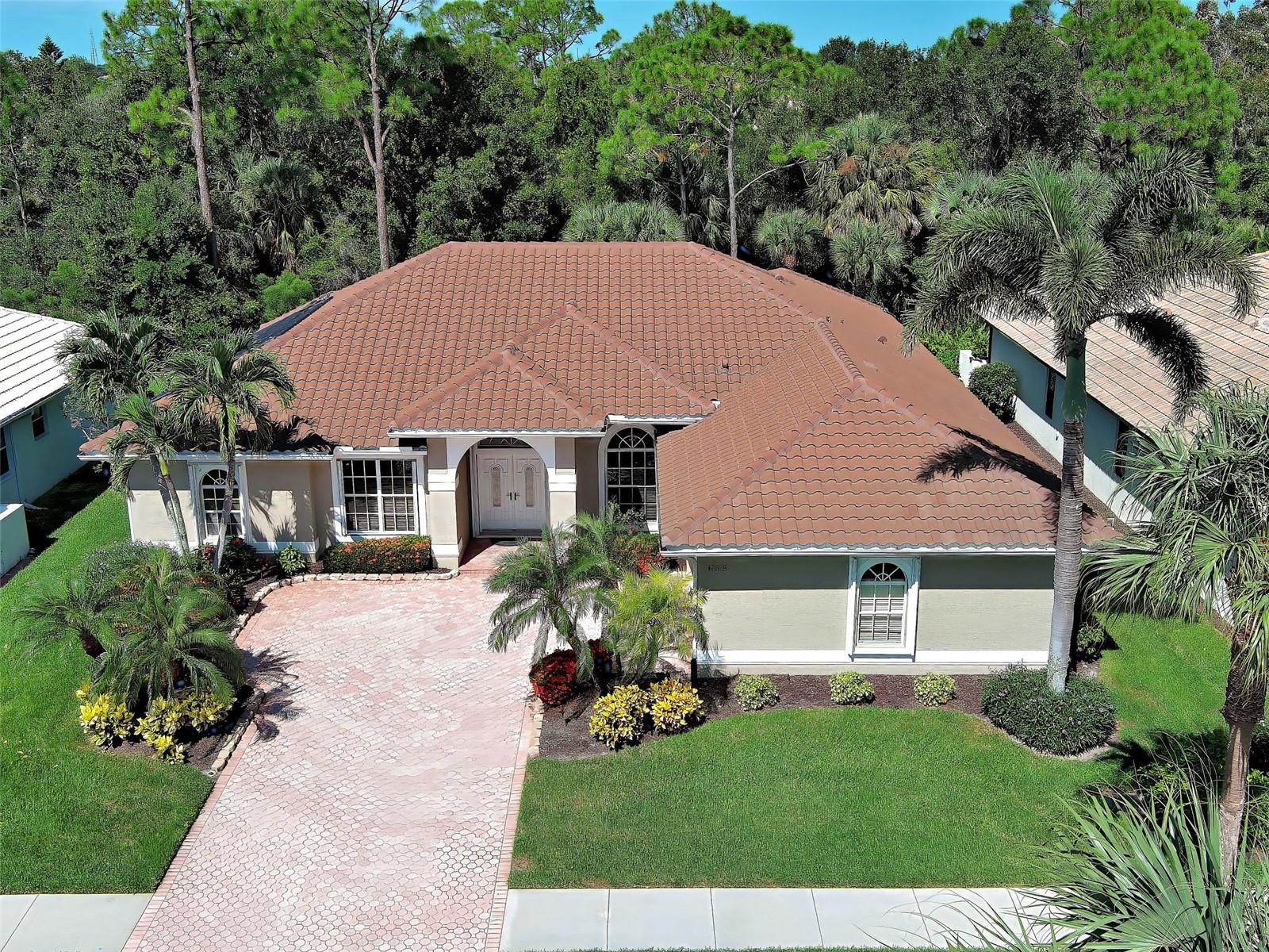 Welcome to this exquisite home which offers 3 spacious bedrooms, a large office/den, 2 1/2 bathrooms and over 3,000 square feet of thoughtfully designed living space. This spectacular home has a solar heated pool, an expansive, private lanai, an over-sized 2-car garage and over $125,000 in improvements. Located in the sought after gated, golfing (optional) Sawgrass community and set on a large lot, it has a new tile roof (2022), new clear view pool cage and new AC (2023). Sellers had an inspection and made all necessary repairs - just move right in! The many windows offer an abundance of natural light while the open floor plan dazzles with soaring 12-foot ceilings, crown molding and classy ceramic tiles. The heart of the home is sure to delight with its granite countertops, large island, newer stainless-steel appliances, large breakfast bar and breakfast area with water/preserve views. Adjacent is the roomy family room with built-ins, perfect for relaxing with neighbors or enjoying a favorite movie. Entertaining is a delight, whether in the formal living room, dining room or dining alfresco under the stars on your private lanai. The sumptuous primary suite is a sanctuary with preserve and water views, 2 walk in closets, lanai sliders and an ensuite bathroom with Roman walk-in shower, garden tub, dual vanities and private commode. Guests will appreciate the split floorplan which offers 2 spacious bedrooms and a guest bathroom. Float in your heated pool on the expansive, peaceful lanai with lush tropical landscaping, peekaboo water views, spectacular sunsets, pavers, pool bathroom and outdoor shower - a true oasis. Enjoy peace of mind with full home hurricane protection (easy to operate accordion shutters), a generator with mobile AC unit and the home is not in a flood zone. More to love: the AC is dual zoned, home comes partially furnished, has fresh exterior paint, new gutters, new water heater (2024) and the pool pump (2023) and heater (2019) are newer. You will appreciate the lovely curb appeal thanks to the paver driveway and lush, tropical landscaping. Sawgrass has low HOA fees and no CDD fees and offers a vibrant lifestyle with wonderful amenities, including a resort style community pool, fitness center, active clubhouse and pickleball courts. Ideally located - just 4 miles from Venice Island’s beaches, dining, and cultural offerings, this home is also conveniently close to Sarasota Memorial Hospital, I-75, and the expanding Wellen Park community. Don’t miss this rare opportunity for luxury, location, and lifestyle - this spectacular home truly has it all! Be sure to watch the video.