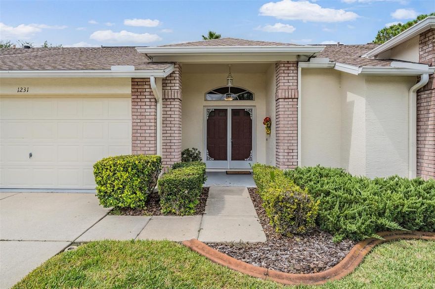 Enjoy stunning golf course views from your very own covered and screened lanai—a perfect place to relax and unwind. NEW ROOF 2016; NEW WASHER 2019; NEW WATER SOFTENER 2022; NEW CARPET 2022; NEW GARAGE DOOR OPENER 2022; NEW A/C 2025. Inside, the oversized great room offers an open, airy feel with engineered hardwood floors and a large picture window that fills the space with natural light while showcasing the lanai and golf course beyond. The remodeled kitchen is a true showpiece, featuring sleek stainless-steel appliances, a breakfast bar for casual dining, crisp white cabinetry, elegant Italian Carrara Marble countertops, and a cozy breakfast nook with views that make every morning special. Designer touches, including Travertine tile, add sophistication throughout the home. The thoughtful floorplan offers a large bonus space that could be a dining area or anything else you would like it to be. This area adjoins the great room, making entertaining seamless. A neutral color palette throughout provides the perfect backdrop for your personal style. Retreat to the expansive master suite, large enough for a sitting area, with a beautifully remodeled bath that boasts an oversized step-in shower. The secondary bedrooms are generously sized and designed to impress. Step outside and experience the comfort of the covered, screened lanai with peaceful golf course views—it’s the lifestyle you’ve been waiting for! 55 & FUN - LIVE THE HERITAGE SPRINGS LIFESTYLE - Resort style living at its absolute finest! Clubhouse with restaurant and bar, fitness, tennis, golf, cards, billiards, dancing and more! SUPERB TRINITY LOCATION, CLOSE TO BEACHES, DINING, SHOPPING, MEDICAL AND AIRPORT! Caution - Adults at Play!