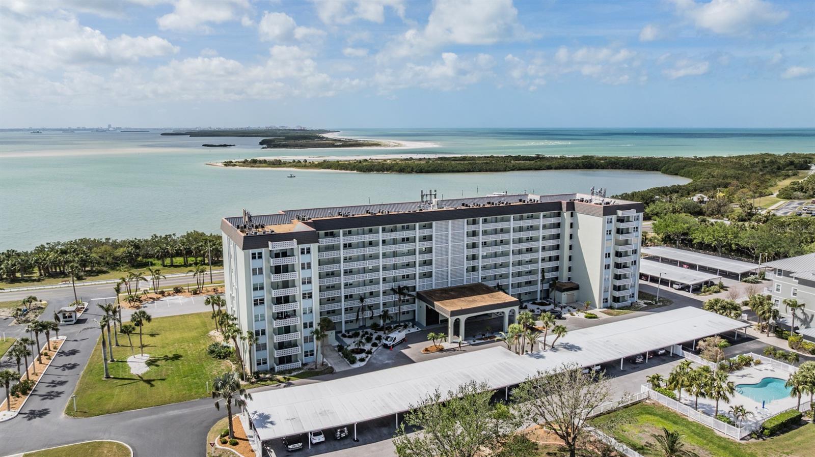 Have you ever imagined living on a tropical island? Make your dreams come true at Royal Stewart Arms. Located on Honeymoon Island this active 55+ community is surrounded by water and it's just steps from Honeymoon Island State Park. Spend your days on the beach looking for that prefect shell or just relaxing in your beach chair. Think about the spectacular sunsets you will see from your balcony with a southern view. This 2 bedroom, 2 bath 3rd floor unit is being sold furnished so it's perfect for that 2nd home or primary residence. The kitchen has stainless steel appliances and tile floors. The rest of the unit has LVP flooring with a wood look. The split bedroom plan is perfect for visiting guests. The community has a large pool overlooking the intracoastal waterway. And it's heated in the winter for year round use. The clubhouse is currently being renovated and has a billiard room, exercise room and sauna. There are tennis, pickleball and shuffleboard courts to keep you busy. The Pinellas Trail is just across the street so get on your bike and enjoy the ride. Do yourself a favor and see this one today.