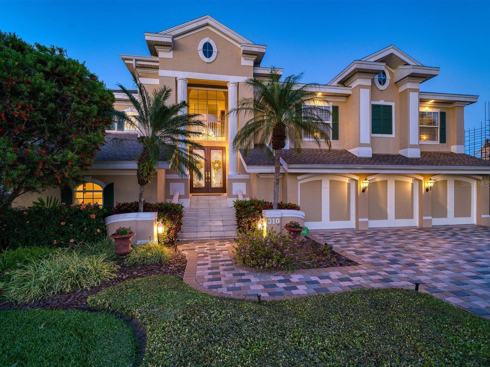 Waterfront --- Prime Location
This stunning custom-built waterfront home was designed for luxury and absolute tranquility in Indian Rocks Beach close to the white sand beach. Experience unparalleled finishes and a keen attention to detail, crown molding and a gated wine “speak easy”. French doors to the covered terraces and floor to ceiling windows offer panoramic vistas that capture the essence of breathtaking waterfront living. Hosting gatherings becomes a pleasure, as this magnificent space provides the perfect backdrop for entertaining guests and creating cherished memories.
Prepare culinary delights in the spacious eat-in kitchen, where functionality meets elegance. Delight in the convenience of a center island with a breakfast bar, double ovens for culinary enthusiasts, and built-in shelves that house your cherished cookbooks, granite countertops and wood floors. The antique door leading to the pantry adds a touch of vintage charm and while the separate wet bar offers a stylish space to mix your favorite beverages.
Relax and rejuvenate in the primary bedroom with its own sitting area, private balcony and two separate ensuites and two custom walk-in closets. In addition to the four spacious bedrooms, this home boasts a versatile office/exercise room, providing a dedicated space for work or wellness. Deep-water awaits avid boaters, as this property offers a true paradise for maritime enthusiasts. With seamless access to the Intracoastal Waterway and the Gulf of Mexico, you can embark on endless nautical adventures and immerse yourself in the splendor of aquatic bliss. After a day on the water, indulge in a relaxing soak in the spa, as the sun sets and paints the sky with mesmerizing colors, offering a breathtaking backdrop to end your day. This custom-built waterfront haven is an embodiment of refined luxury, where every detail has been thoughtfully curated to provide an unrivaled living experience. Embrace the coastal lifestyle and make this prestigious Indian Rocks Beach residence your forever home. Don't miss this rare opportunity to own a slice of paradise.