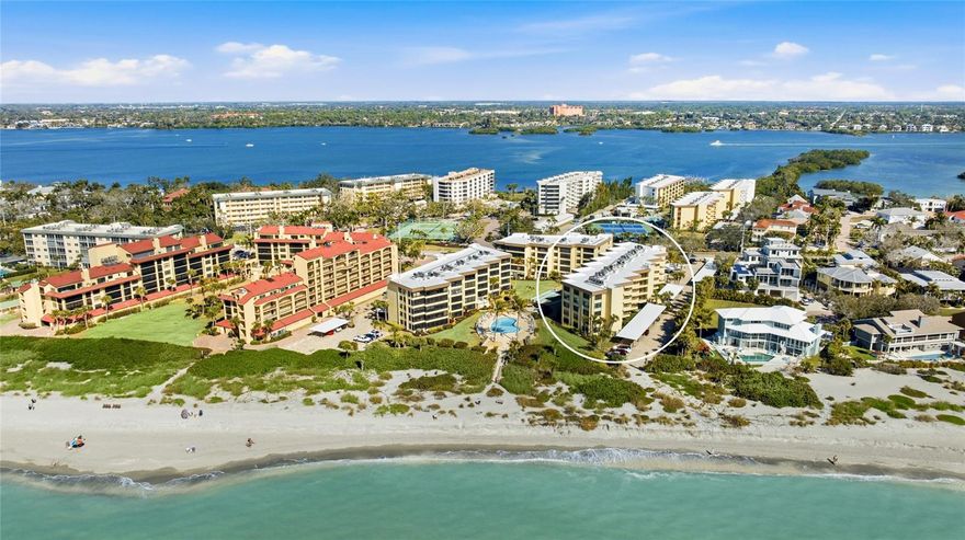 Powdery white sand, warm Gulf breezes, and unforgettable sunset skies are not reserved for vacation here, they become your everyday backdrop in this beautiful Gulfside second floor 2 bedroom, 2 bathroom condo at Island Reef on Siesta Key. Easily accessible right off the elevator, this spacious condo is just steps from the beach and the Gulfside pool. Inside, an easy modern coastal design complements the Gulf views. The open living and dining areas feel airy and inviting, with large windows that frame the water and keep the view front and center. 
In-unit laundry adds every day convenience and a close by covered parking spot enhances the ease of ownership. The community of Island Reef offers a Gulf to Bay setting that allows residents to fully embrace waterfront living from both sides of the island. Spend your mornings walking the shoreline, your afternoons fishing from the pier or launching a kayak into the Bay, and your evenings enjoying the calm, coastal atmosphere that defines this community. Life here extends far beyond the walls of your condo. Two heated pools provide options for relaxation or socializing, while the fitness center, tennis and pickleball courts, shuffleboard, kayak/bike storage, and available boat slips support an active lifestyle. The clubhouse hosts regular gatherings that foster connection among neighbors, and additional features such as the game room, library, grilling patios, car wash areas, and on site management add both convenience and a sense of community. 
 **THIS PROPERTY QUALIFIES FOR A 1% LENDER INCENTIVE IF USING PREFERRED LENDER. INQUIRE FOR MORE DETAILS.**