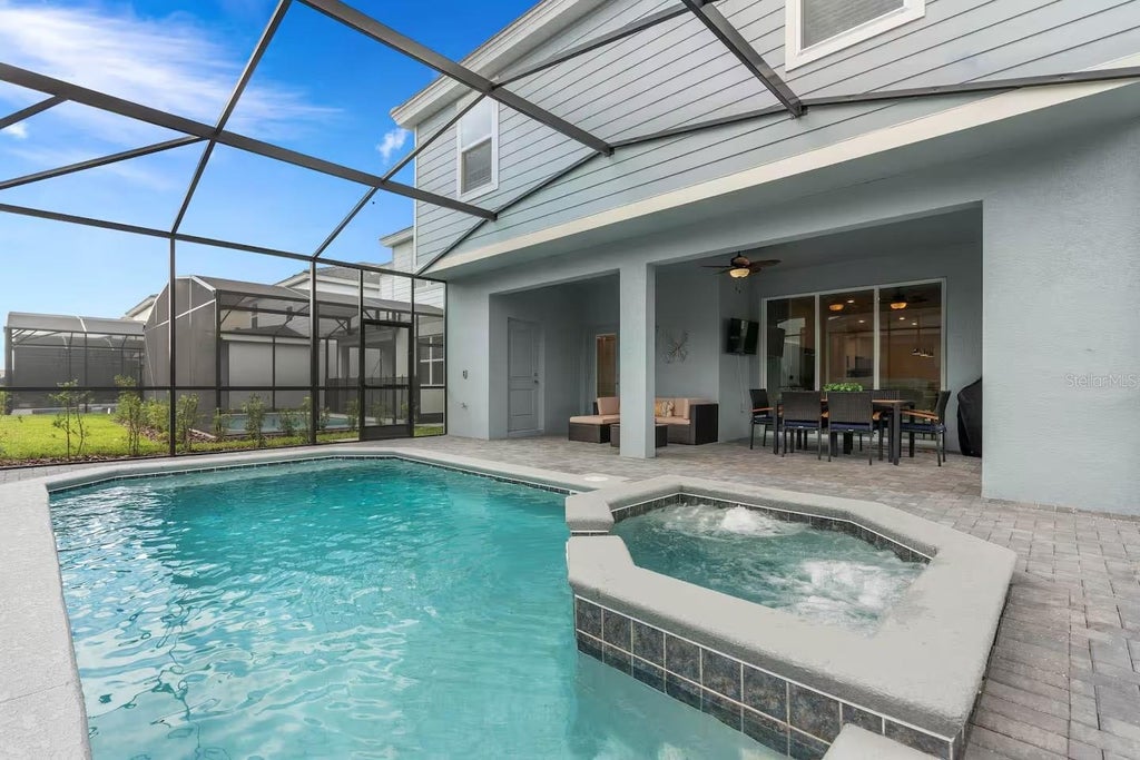 Photo of 7180 Oakmoss Loop, Davenport, FL 33837 (MLS # O6449287)